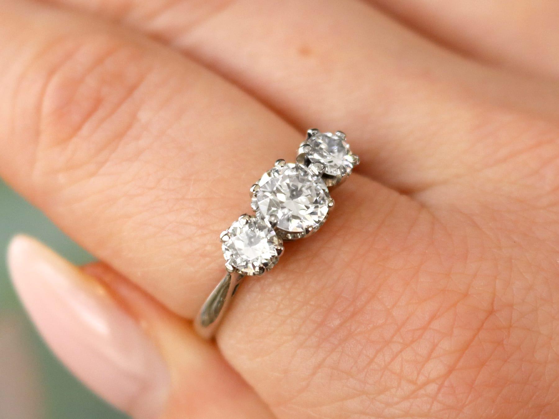 A stunning, fine and impressive vintage 1.51 carat diamond and 18 karat white gold trilogy ring; part of our diverse diamond jewelry and estate jewelry collections.

This stunning, fine and impressive diamond trilogy ring has been crafted in 18k