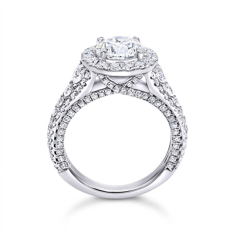 Round Cut Diamond Halo Engagement Ring

Handcrafted in 14k White Gold

Contains 1.51ct center stone, J Color, SI2 Clarity

Round shaped Pave diamond halo of 1.75ct diamonds

GIA Certified #2175736379