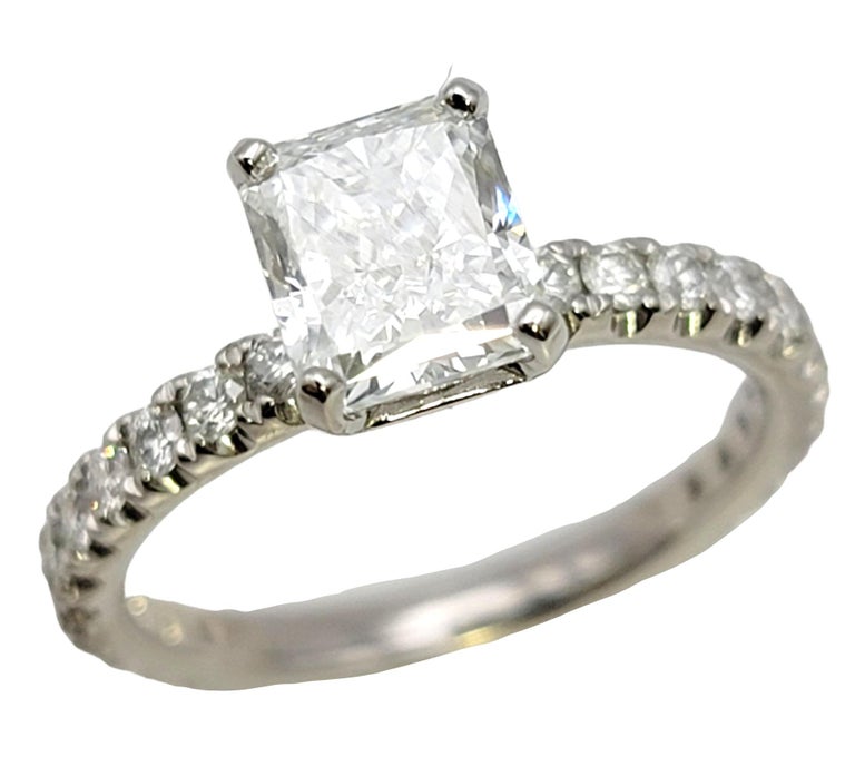 Ring size: 6.5

A proposal with this incredible diamond solitaire engagement ring is a guaranteed yes! This absolutely beautiful engagement ring features a single 1.51 carat radiant cut natural diamond (E in color / VS2 in clarity) 4 prong set in