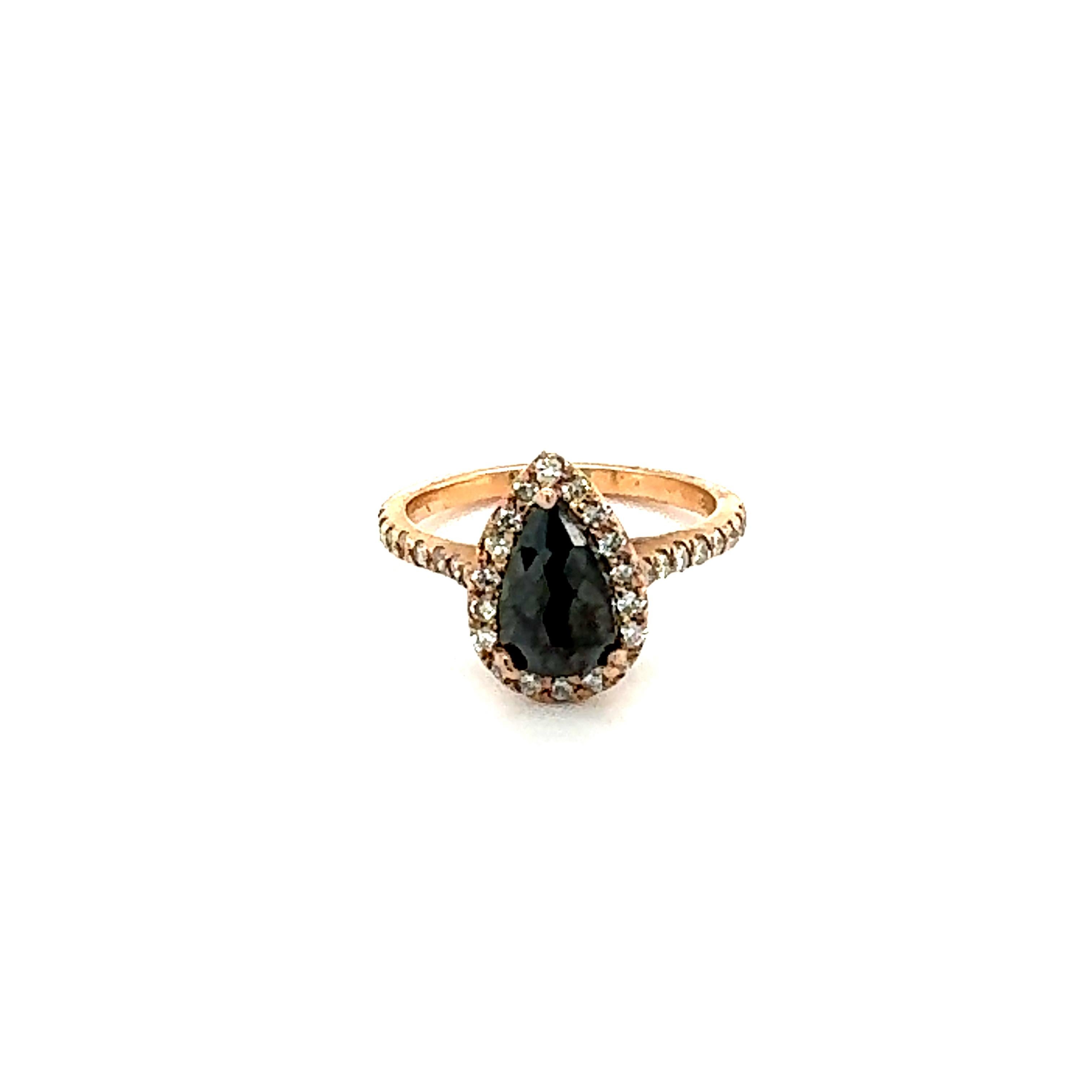 1.51 Carat Pear Cut Black Diamond 14 Karat Rose Gold Engagement Ring
Gorgeous Black Diamond ring that can transform into an Engagement ring!! 

There is a 1.09 Carat Pear Cut Black Diamond in the center on the ring which is surrounded by a Halo of 