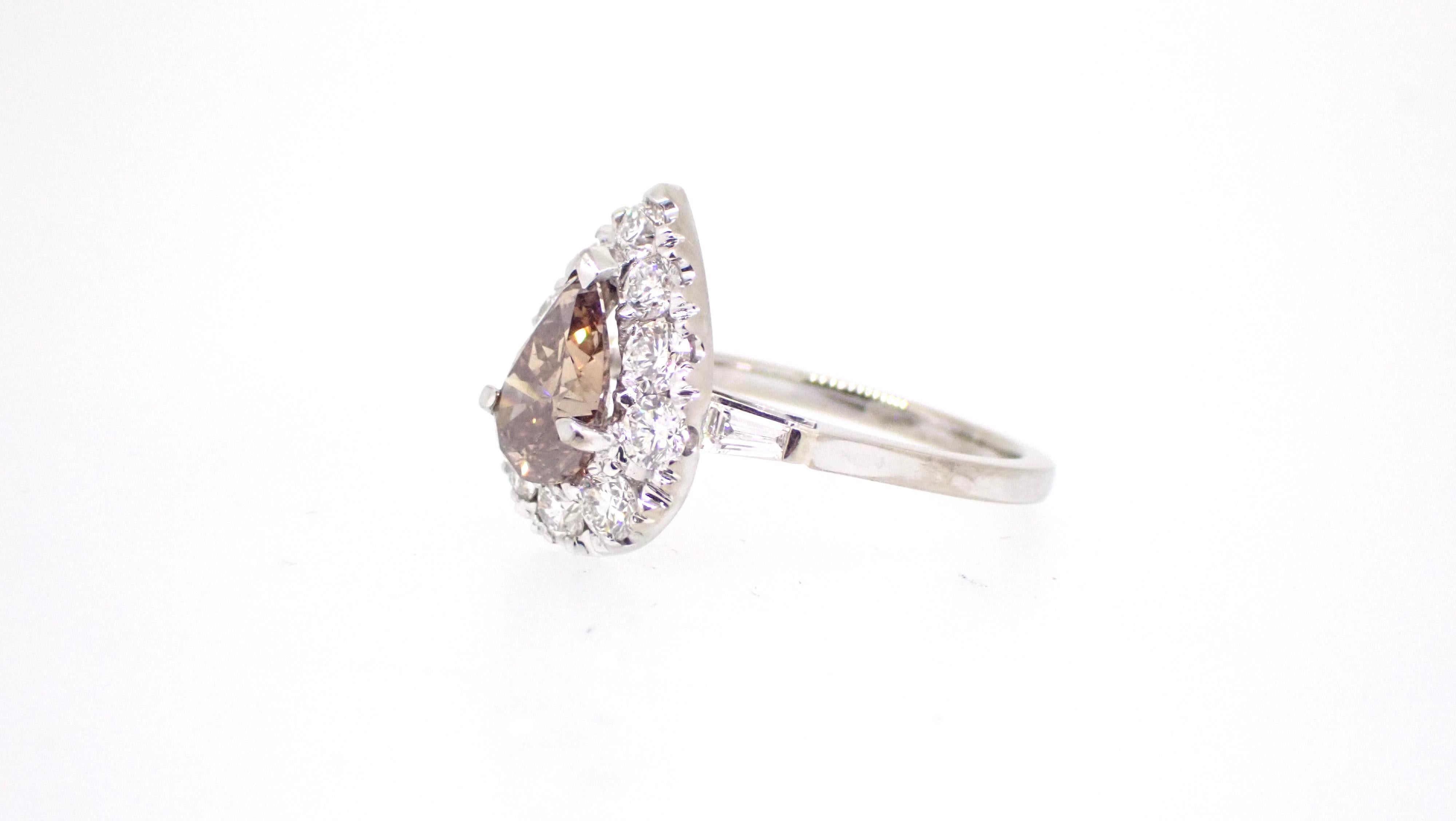 This modern take on this 1.51 Carat Pear Cut Champagne Diamond has all the features of a classic design set to pass the tests of time. 

It has all the ingredients for a 