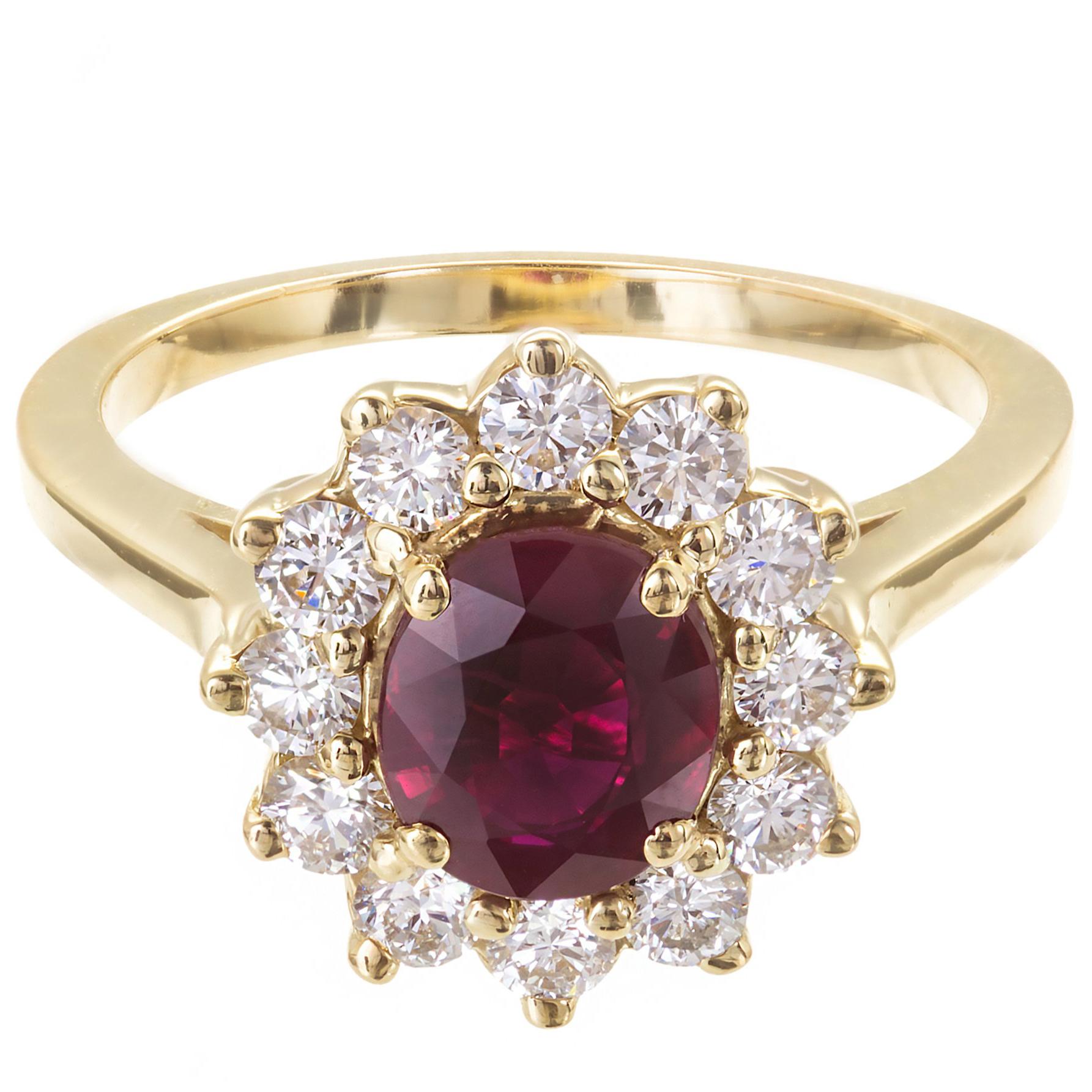 Ruby and diamond halo engagement ring. Excellent brightness and saturation. Heat with minor residue. Simple oval cluster with fine white sparkly diamonds in 18k yellow gold setting.

1 oval Red Ruby, approx. total weight 1.51cts, VS, 7.12 x 6.12 x