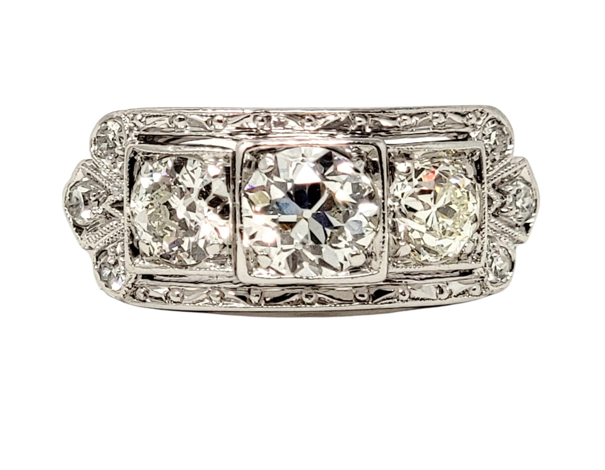 Ring size: 6.25

Stunning vintage diamond engagement ring with incredible Old World charm. This 3 stone platinum beauty features a single prong set  .62 carat Old European cut diamond at the center flanked by 2 slightly smaller round diamonds. The 3
