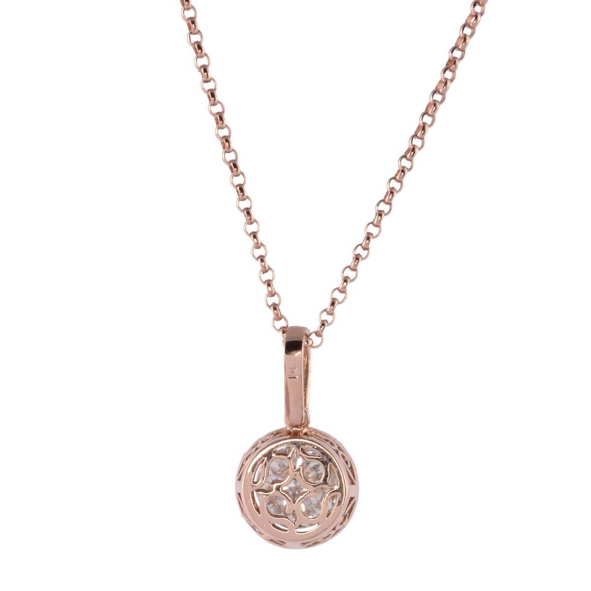 Estate 1.51 carat center diamond pendant on chain. This 14 karat rose gold pendant features a 1.51 carat round brilliant center diamond with VVS2 clarity and M color. The center diamond is encircled with round brilliant diamonds that extend to the