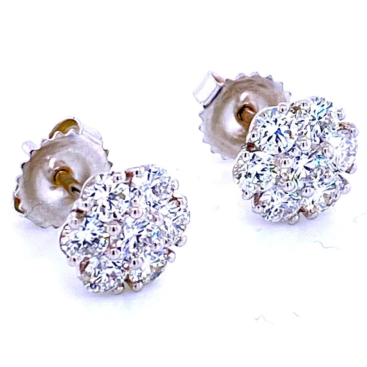 This beautiful pair of earrings is made in 14K Gold with 12 3 mm and 2 3.2 mmOund Brilliant diamonds in a Round Shaped clusters of diamonds 10mm  (looks like 3.5 Ct each). Total weight of diamonds is 1.51 Ct.