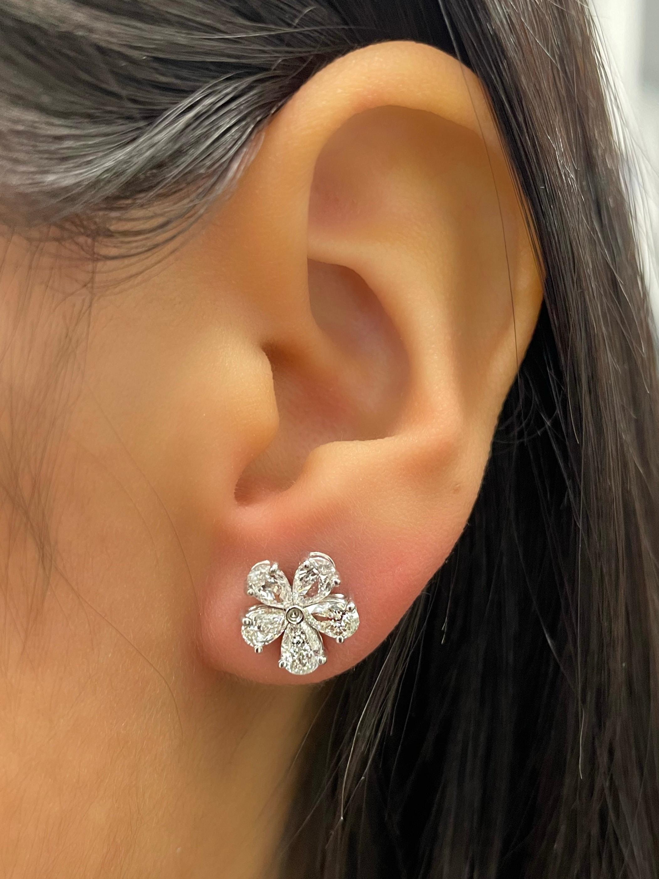 These gorgeous diamond earrings feature 10 diamonds weighing 1.51 ct set in 18k white gold. These diamonds boast a color of G and SI1 in clarity. A great earring to wear everyday or a night on the town!