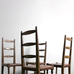 151 Set of 4 chairs with walnut frames and brown leather seats -