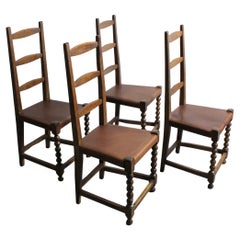 151 Set of 4 chairs with walnut frames and brown leather seats -