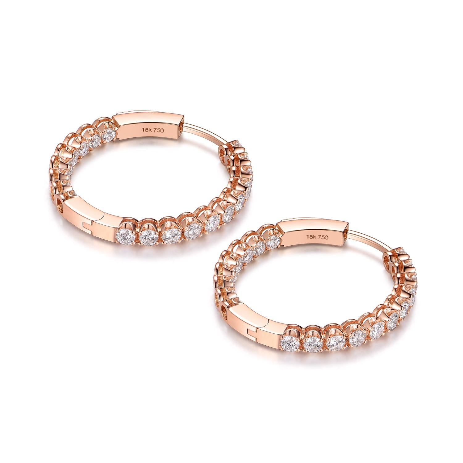 Presenting our 18 Karat Rose Gold Diamond Hoop Earrings, a striking blend of elegance and contemporary design. These stunning earrings are a testament to refined taste and high-end craftsmanship, and are bound to make a chic addition to any jewelry