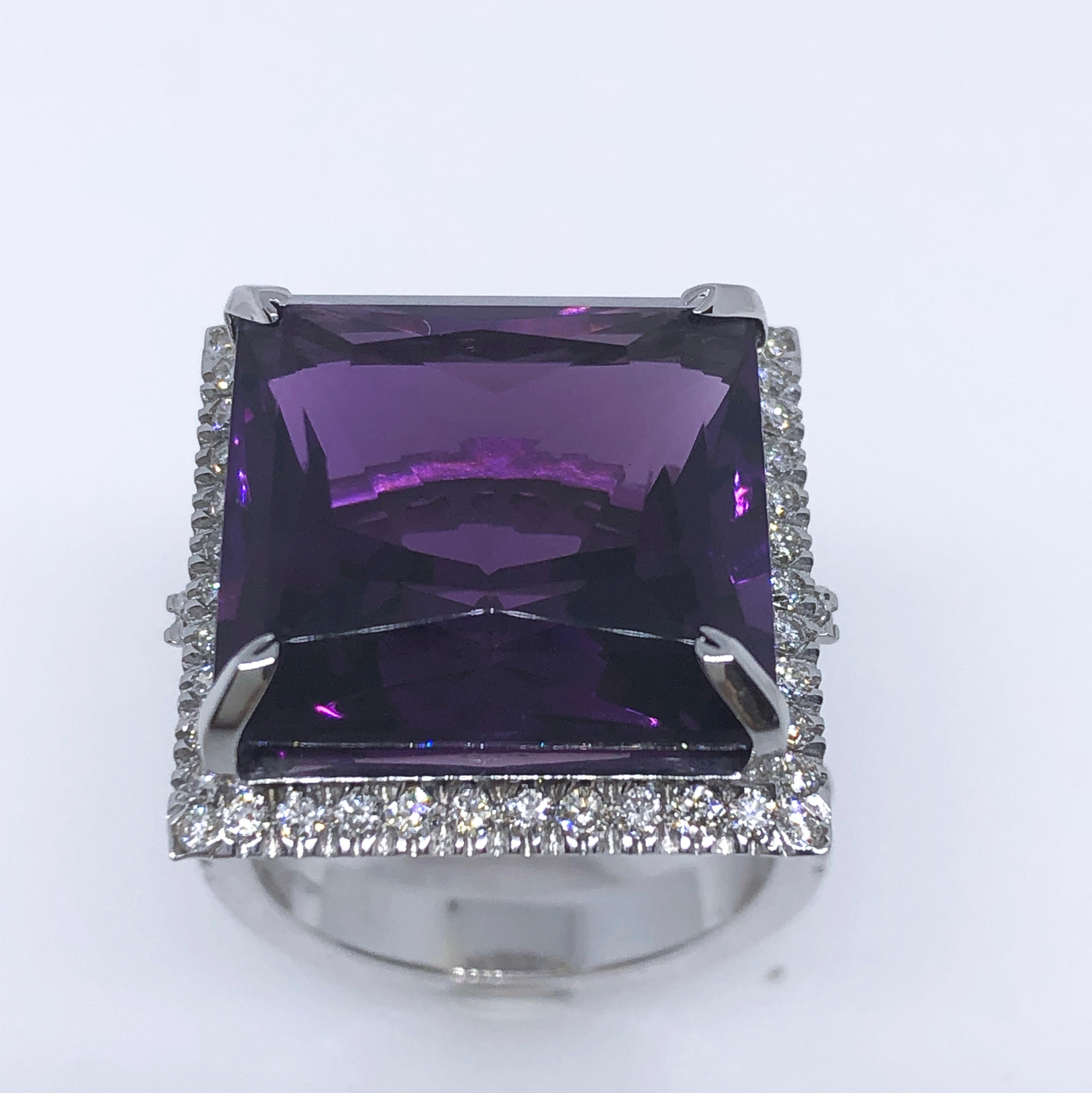 Sumptuous and One-of-a-kind Cocktail Ring featuring a 15.10 Carat Princess Cut Natural Velvety Purple Amethyst in a 0.98Carat, 66 round White Diamond 18 Carat White Gold Setting.
In our fitted Burgundy Leather Case.

Amethyst 0.600x0.605inches
0.287