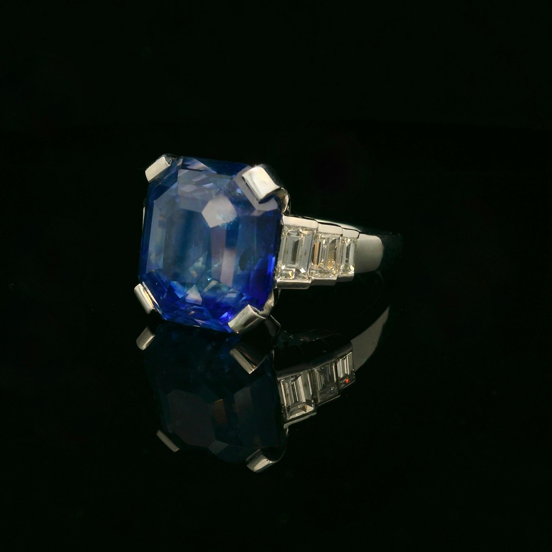 New ring made of white gold 18K. 

Diamond and sapphire Ring set with a natural heated emerald cut Ceylon sapphire of 15.11 Carats and 6 baguettes shape diamonds of 1.08 Carats total ( G colour - Vs clarity). 
We brought ourselves the sapphire from