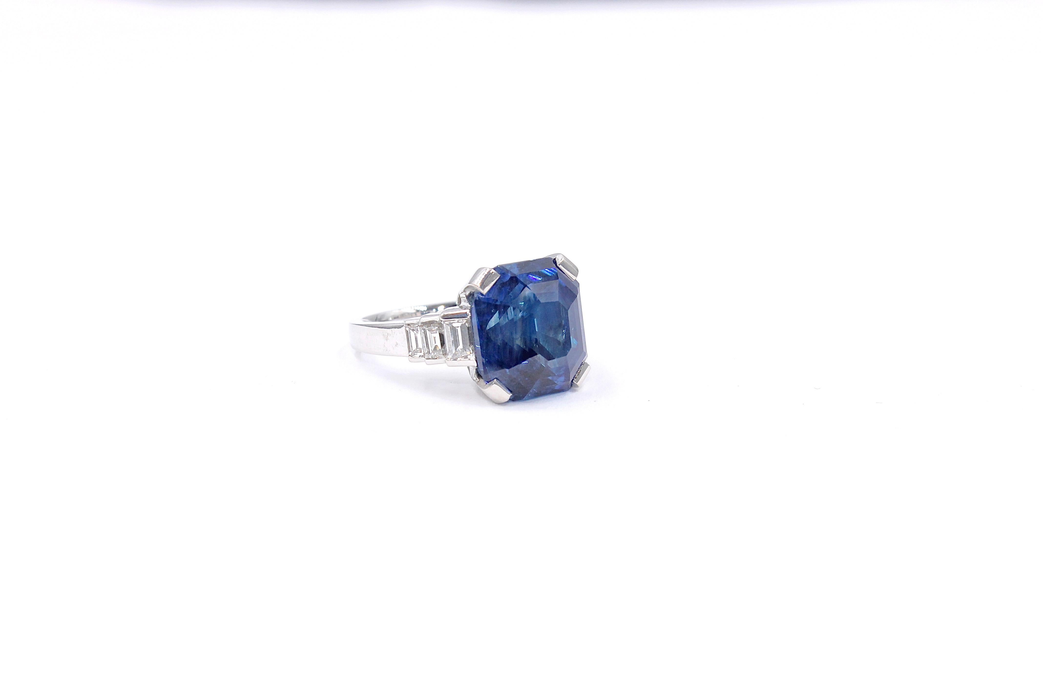 New ring made of white gold 18K. 

Diamond and sapphire Ring set with a natural heated emerald cut Ceylon sapphire of 15.11 Carats and 6 baguettes shape diamonds of 1.08 Carats total ( G colour - Vs clarity). 
We brought ourselves the sapphire from