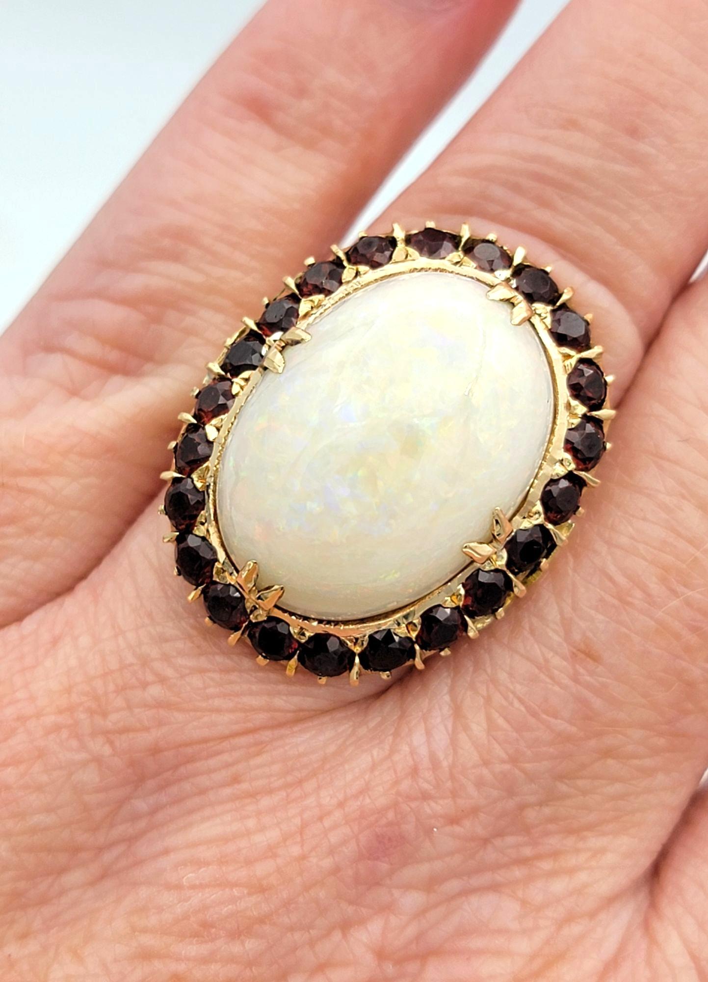 15.12 Carat Oval Cabochon Opal Cocktail Ring with Garnet Halo in 14 Karat Gold For Sale 2