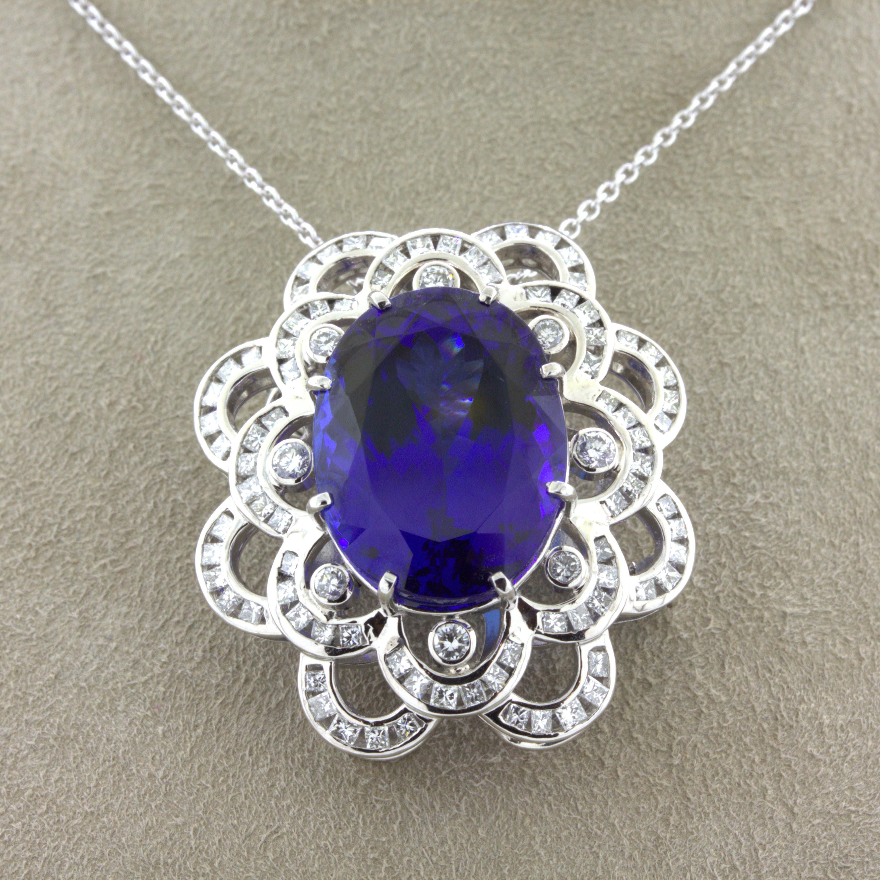 A large 15.12 carat gemmy tanzanite takes center stage of this platinum made pendant which can also be worn as a brooch. It has a rich jelly purplish-blue color that often gets misidentified as sapphire due to its rich dominantly blue color. The