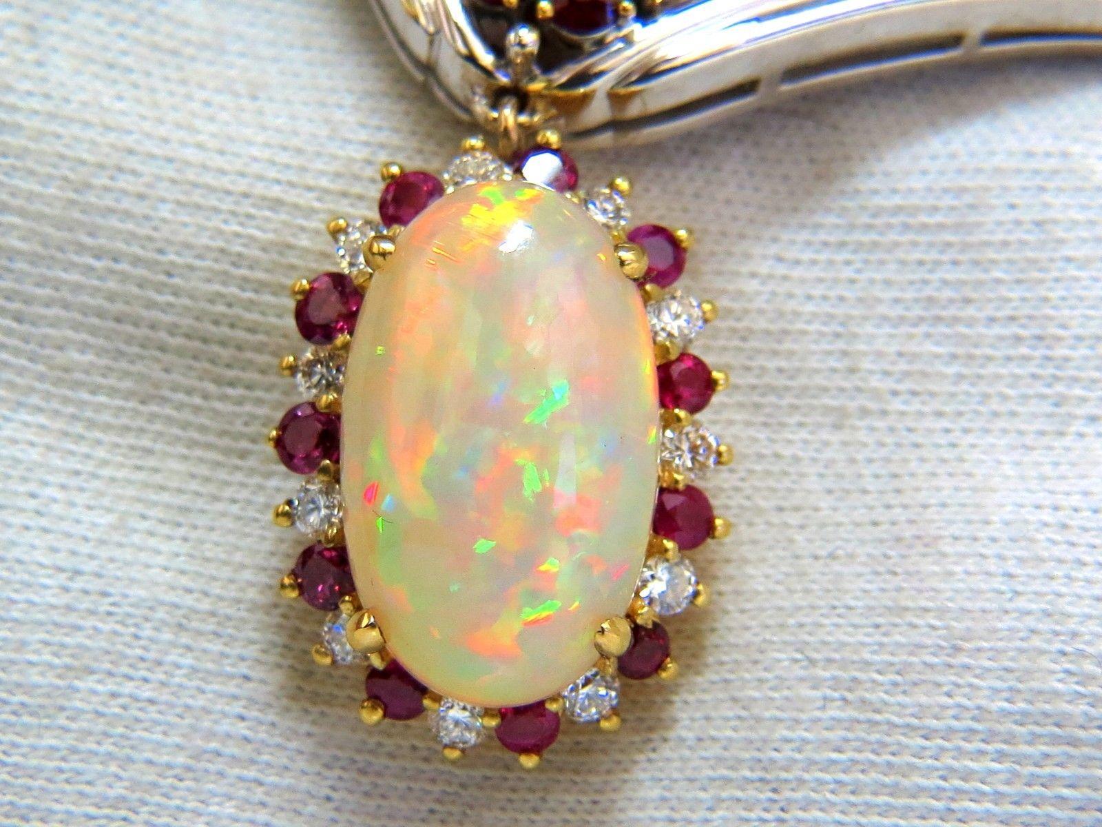 15.14ct. Natural Opal Necklace

Oval Cabochon cut

Superb Vibrant Flashes of colors

Reds, Orange, Blues and Greens.

23 x 14mm Diameter.



3.70ct natural Ruby

1.08ct. Fancy Green Brown Diamond

Side natural diamonds: .50ct.

Full cuts and