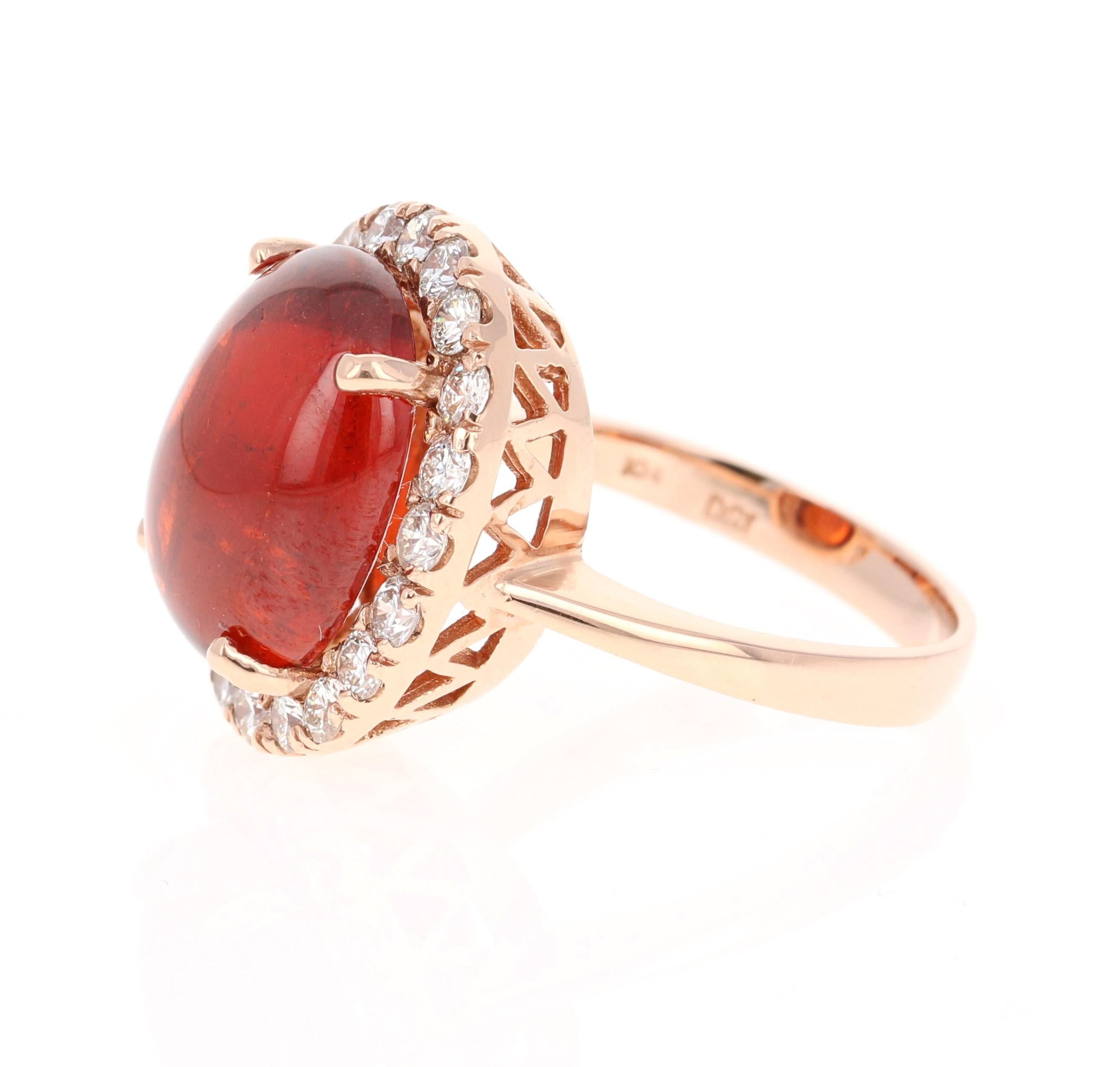 This breath taking ring has a 14.05 Carat Oval Cabochon Cut Spessartine Garnet. Spessartines are natural gemstones found in the Garnet family. It has 20 Round Cut Diamonds that weigh 1.09 Carats. The clarity and color of the diamonds are VS2-H. The