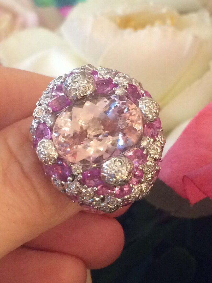 15.15 carat total Oval Kunzite, Pink Sapphire & Diamond Cocktail Ring in 18k White Gold

Stunning Pink Sapphire and Diamond setting features a large Soft Pink Oval Kunzite in the center estimated to weigh 8.00 carats surrounded by 28 lively bright