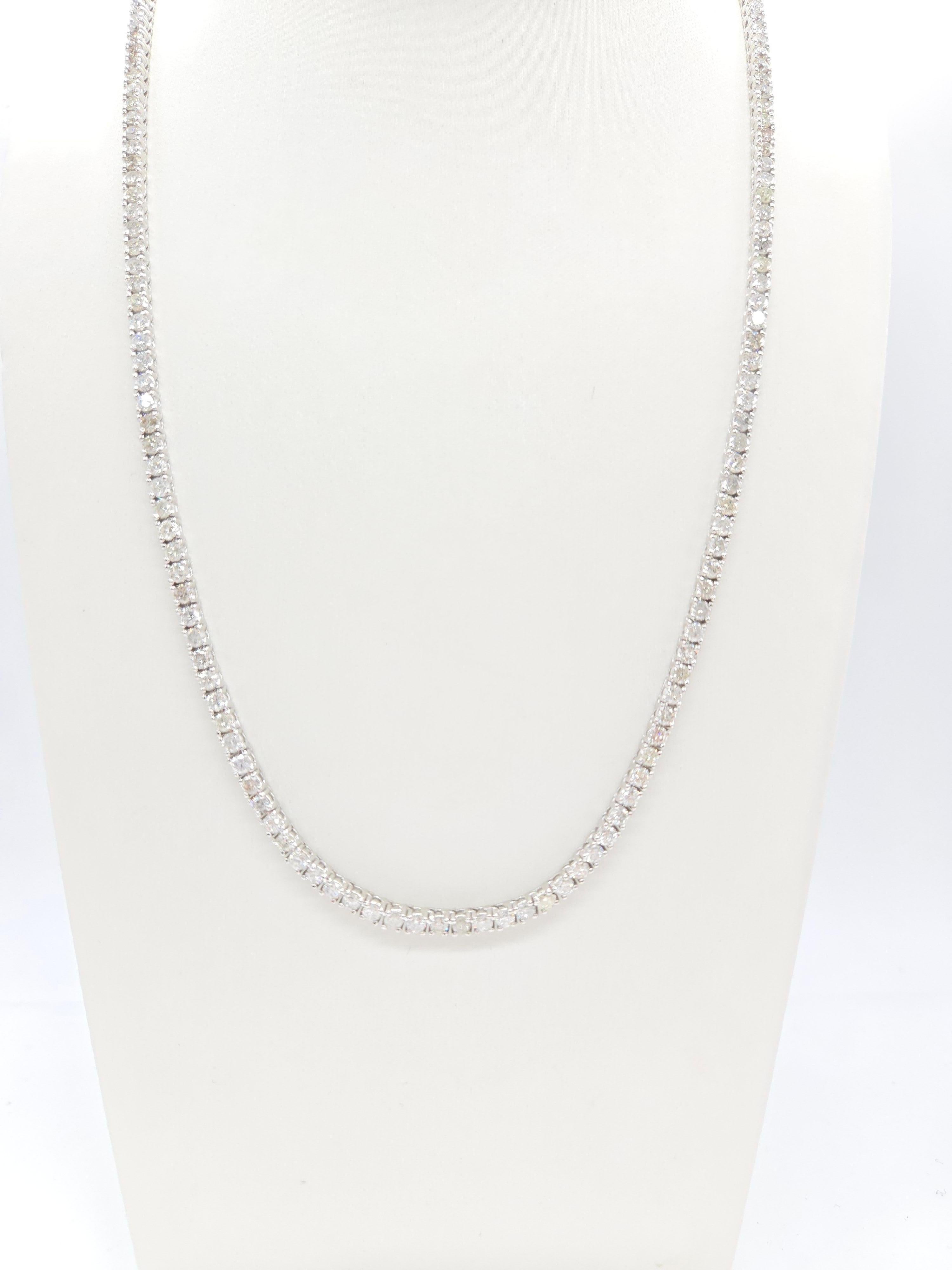 Elegant Tennis Necklace with Round-Brilliant Cut White Diamonds

This luxurious tennis necklace showcases round-brilliant cut white diamonds, renowned for their exceptional sparkle and brilliance. With a classic four-prong setting, the necklace