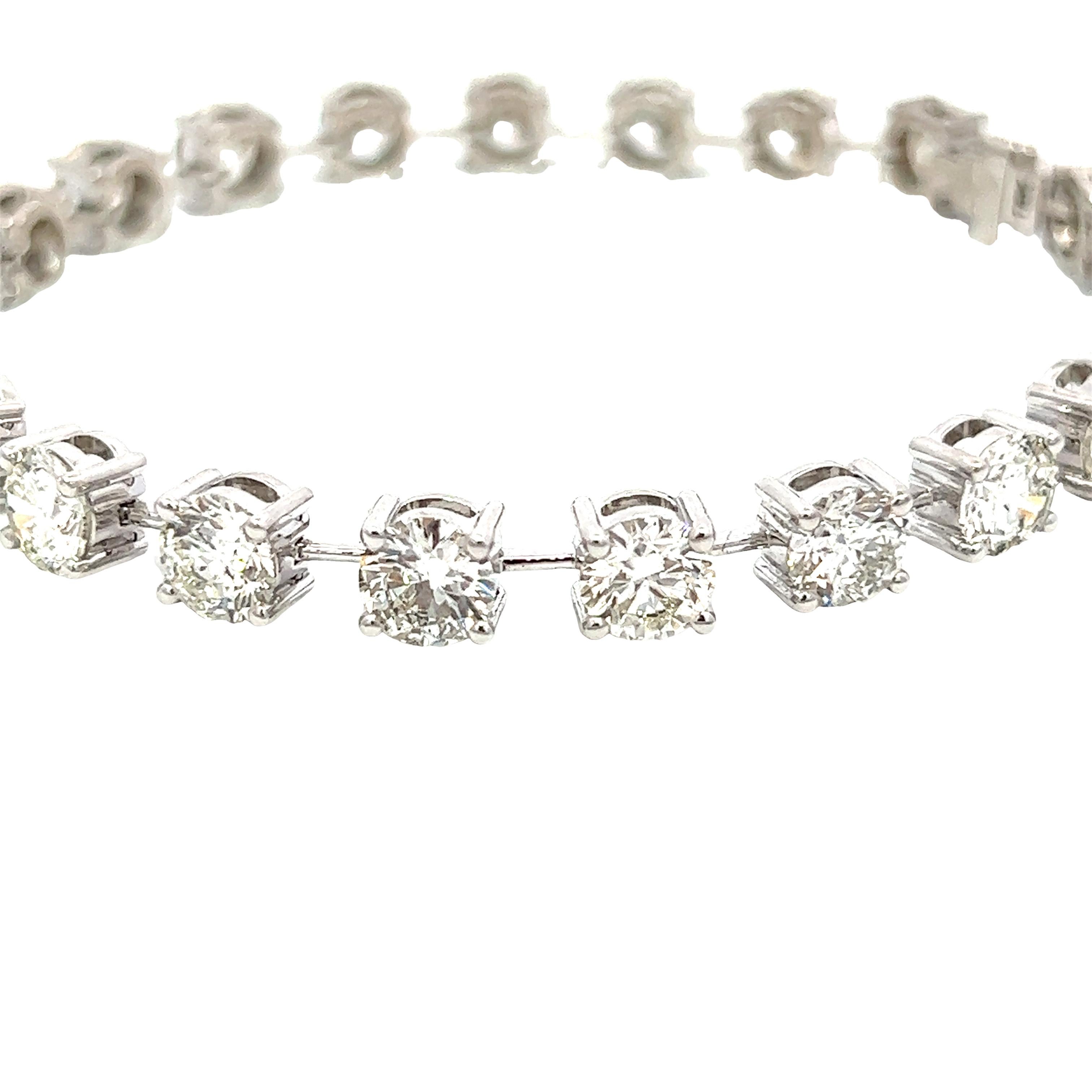 Set in 18k white gold, this 15.15CT round brilliant diamond bracelet features 21 stones. It is 7to your preference. inches long but can be resized 