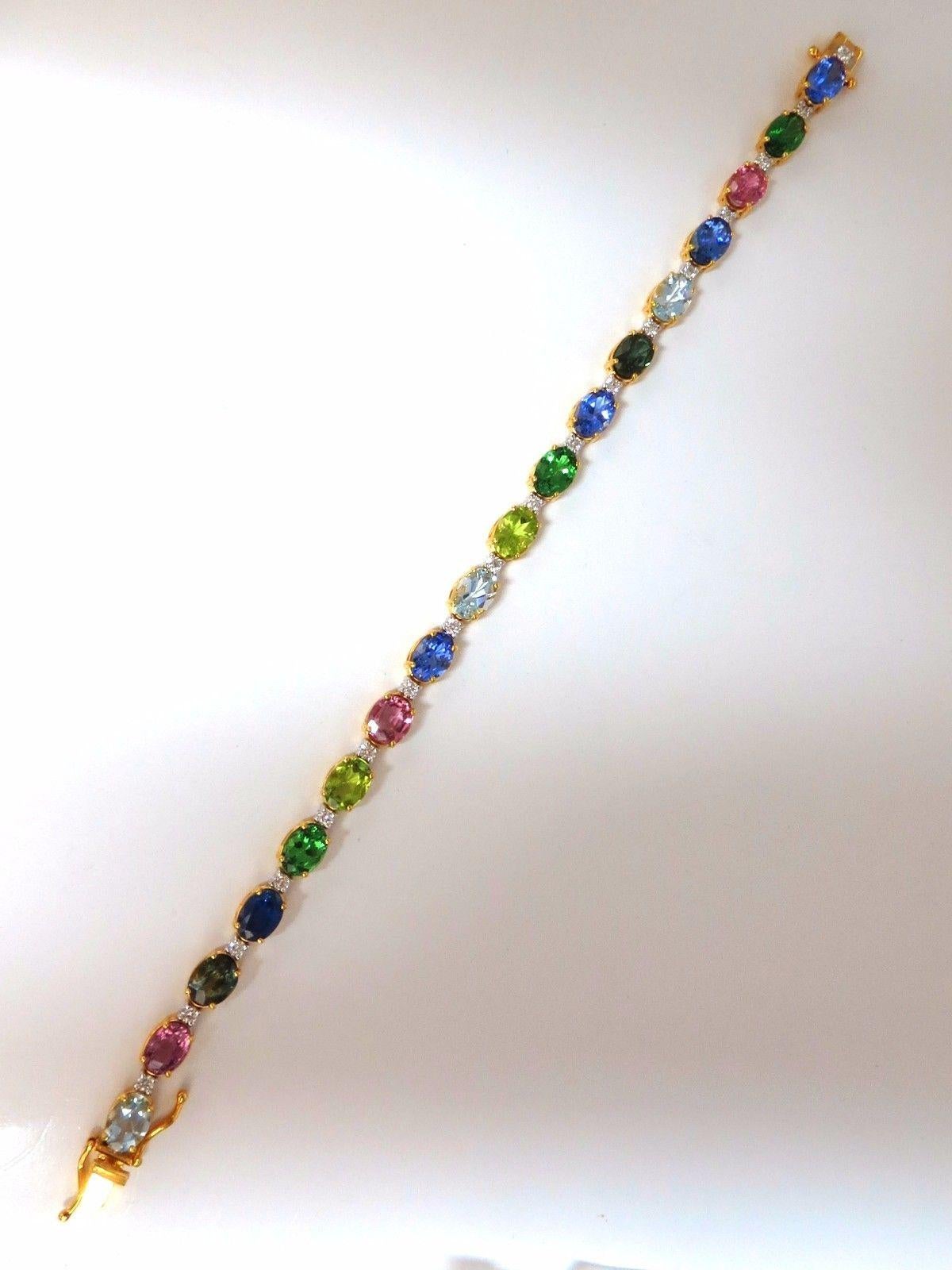 Spring Color Palette.

14.52ct. Natural Tsavorites, Spinels, Tanzanite,

Aquamarine, sapphires & .65ct Diamonds bracelet.

Full oval cuts, great sparkle.

Vibrant Greens, Orange, Reds, yellows, Blues and Pinks

Clean Clarity &