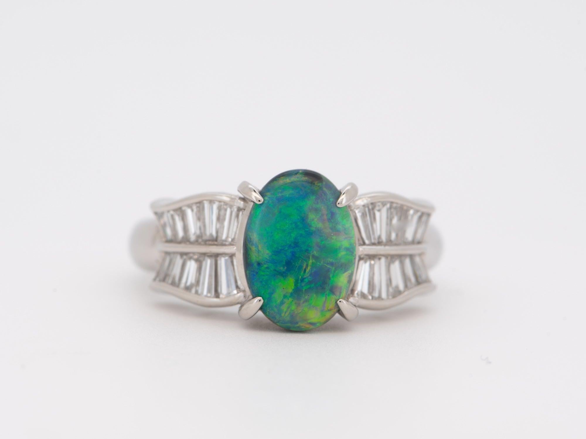 ♥ 1.51ct Australian Black Opal with Baguette Diamond Ring Platinum 8g+ V1147
♥ This is a gorgeous ring set with a solid black opal in the center, surrounded by 0.72ct worth of diamonds on the band.
♥ The item measures 10.4mm in length (North South