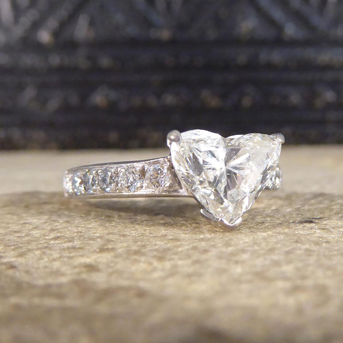 This beautifully sparkly engagement ring holds a bright white and sparkly Heart Cut Diamond weighing 1.51ct in a three point setting. The centre Diamond itself is very high in colour with an independent grading (HRD Gem Cert) of F colour and nil