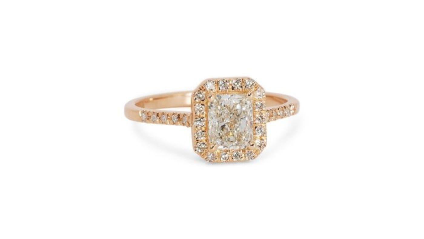 Embrace captivating allure with this exquisite ring, showcasing a mesmerizing 1.51-carat radiant diamond. This breathtaking centerpiece, meticulously cut to maximize its brilliance and fire, rests atop a radiant 18K yellow gold band, polished to a