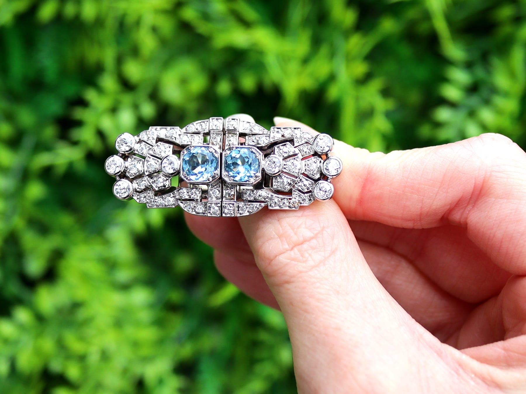 A stunning, fine and impressive antique 1.52 carat aquamarine and 2.92 carat diamond, 18 karat white gold and platinum set double clip brooch; part of our antique 1920s jewelry collections.

This stunning, fine and impressive antique 1920s brooch