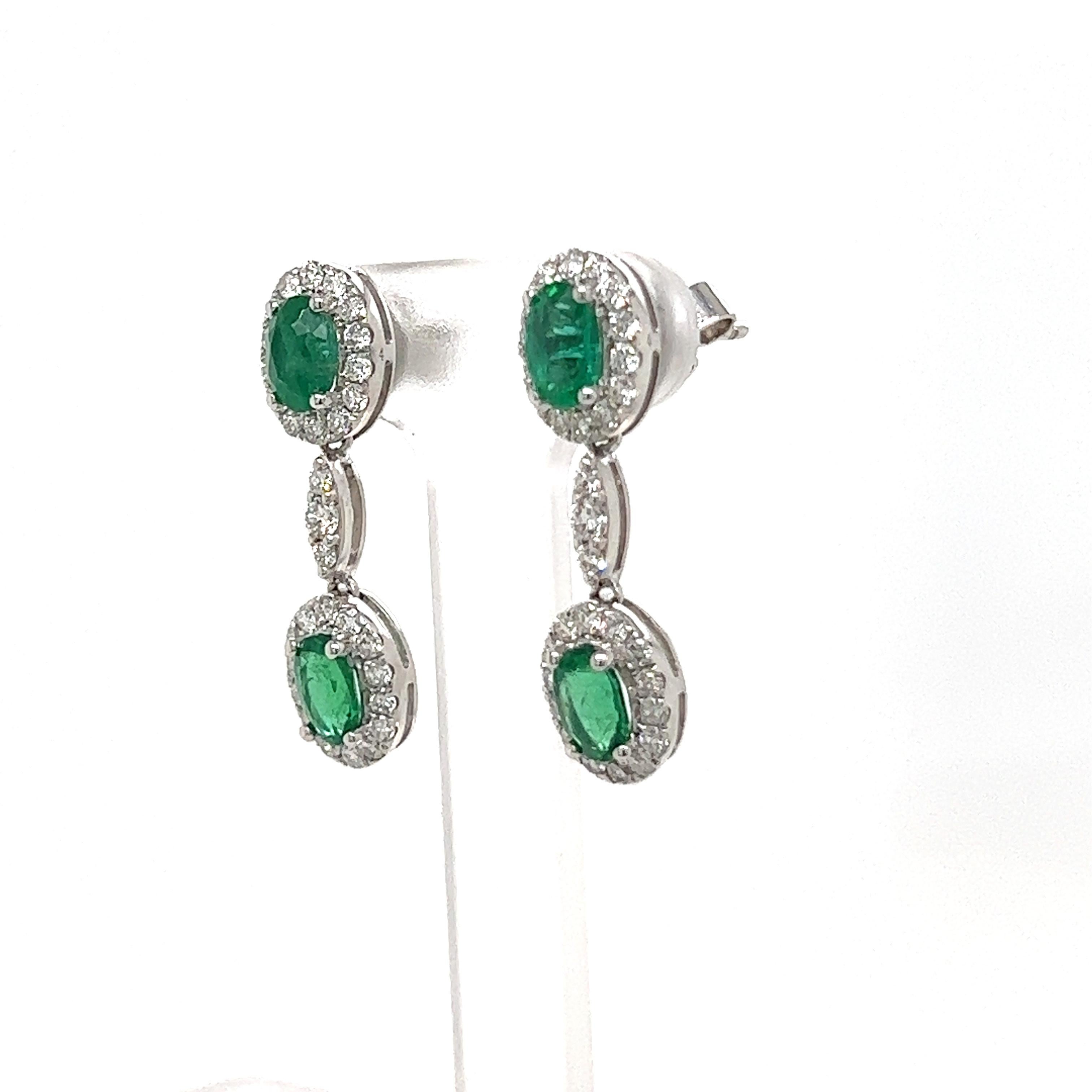 In love with these contemporary emerald and diamond earrings! They have 1.52 total carat weight  of beautiful green emeralds surrounded by .93tcw of bright white diamonds, G color, VS2 clarity. Set in 18k white gold. 
#49598