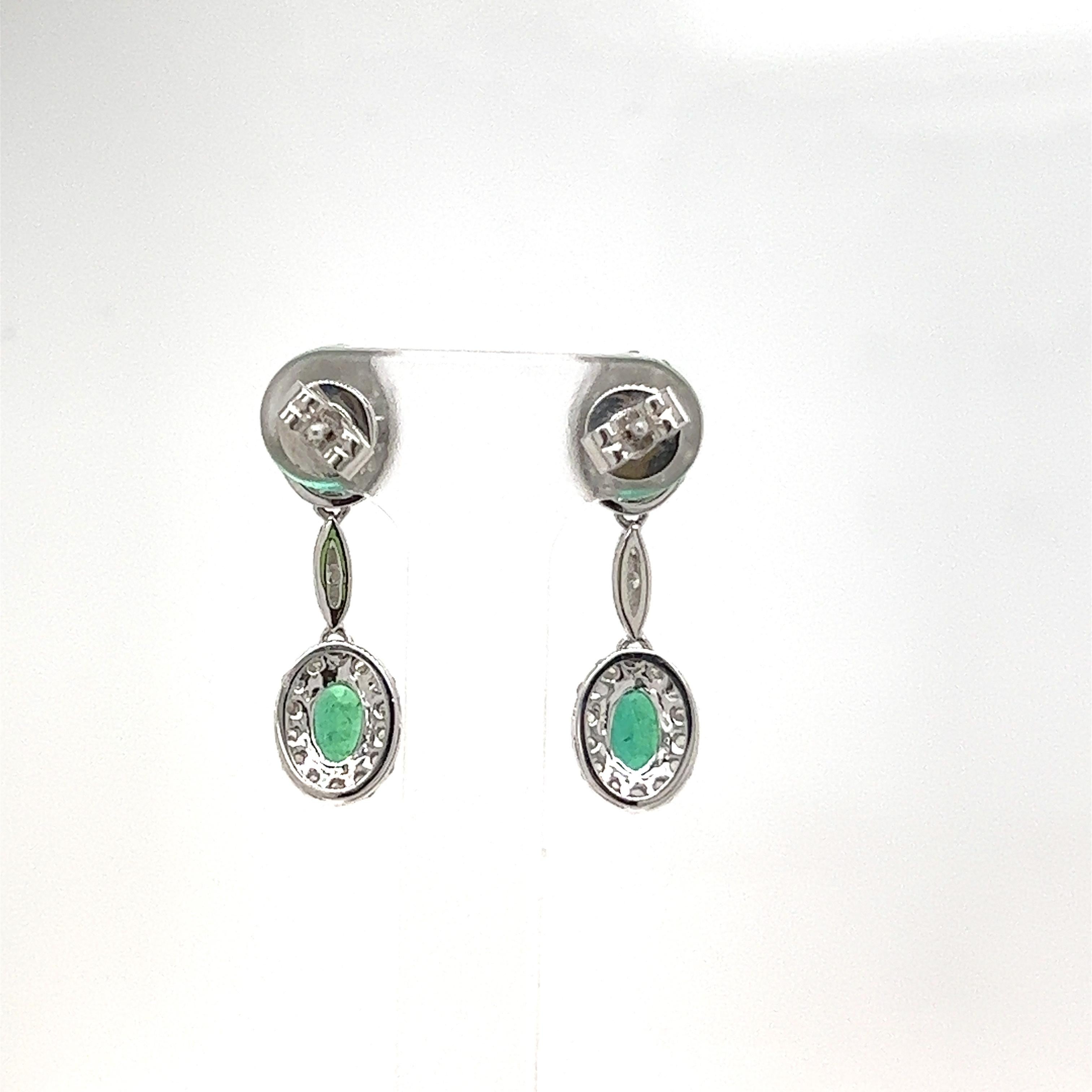 Oval Cut 1.52 Carat Emerald and Diamond Dangle Earrings For Sale