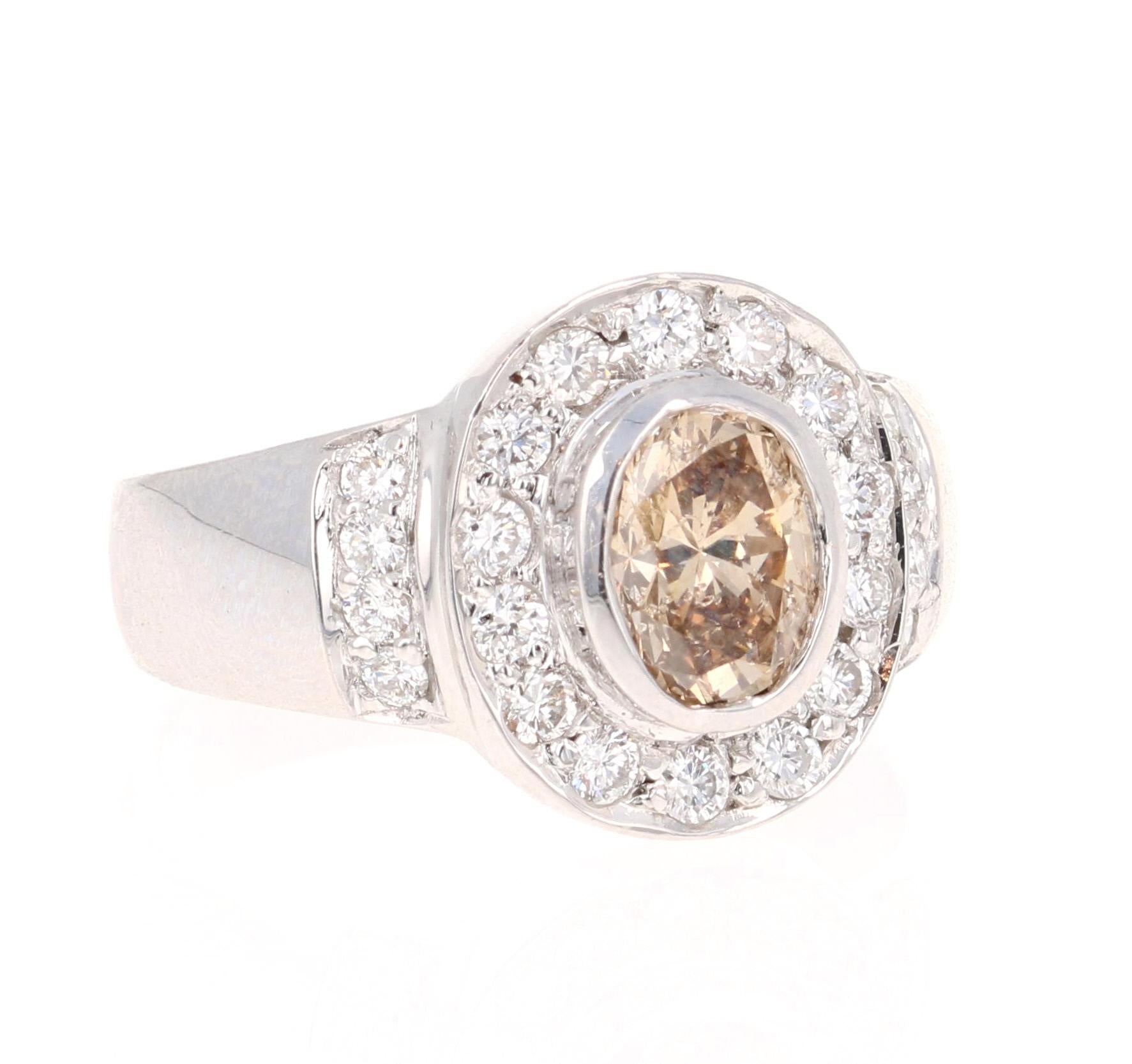 This versatile ring can be a cocktail ring, engagement ring, or an everyday ring! 

The center diamond is a natural, fancy colored Oval cut Brown/Champagne Diamond weighing 1.01 Carats. The ring is surrounded by a halo of 22 Round Cut Diamonds that