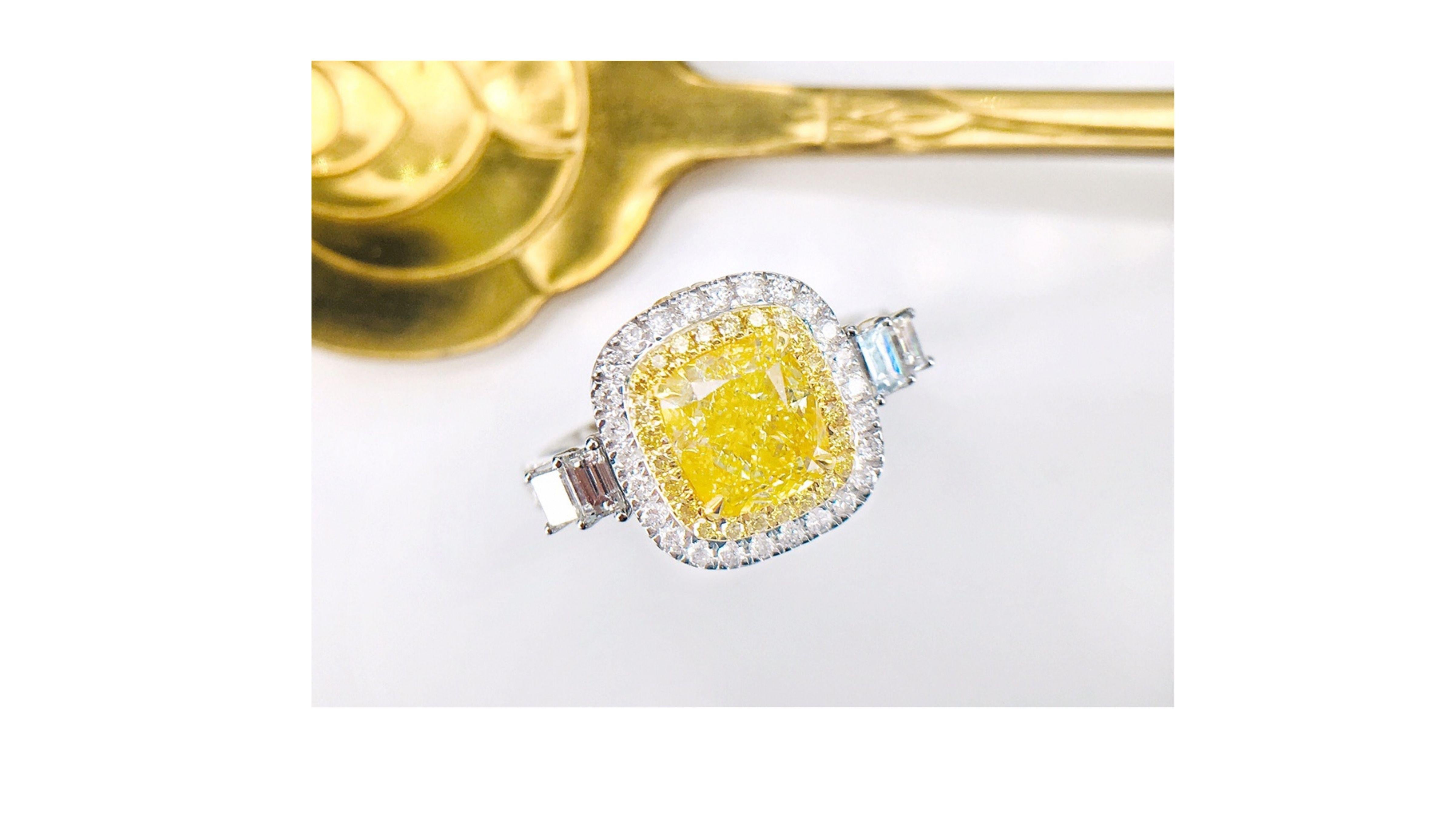 
This  Fancy Yellow Diamond Ring shows off a 1.52 Carat stone and stands out with 46 Diamonds inc baguette  ones at each side of the band with diamonds too.  You can also have this in a necklace too as shown in photos so do let us know and if you