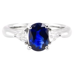 1.52 Carat Natural Blue Sapphire and Diamond Three-Stone Ring Set in Platinum