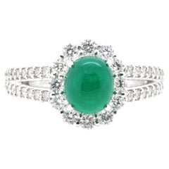 1.52 Carat Natural Emerald Cabochon and Diamond Halo Ring Set in Platinum