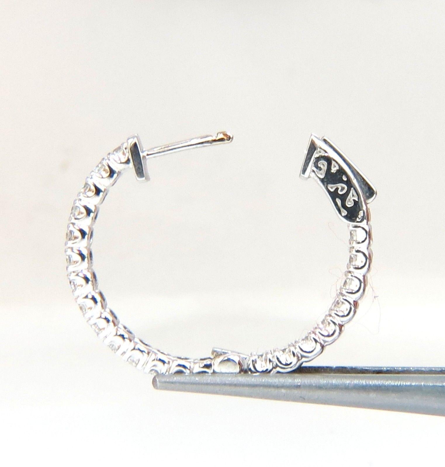 Mid size / Modern, In & Out.

Elongated & wide

1.52ct. Natural Round, Brilliant diamonds hoop earrings.

G color, VS-2 clarity

Full cuts, great sparkle.

1 inch Diameter

 6.5 grams.

14kt. white gold. 

Button press Locking & open

$8000