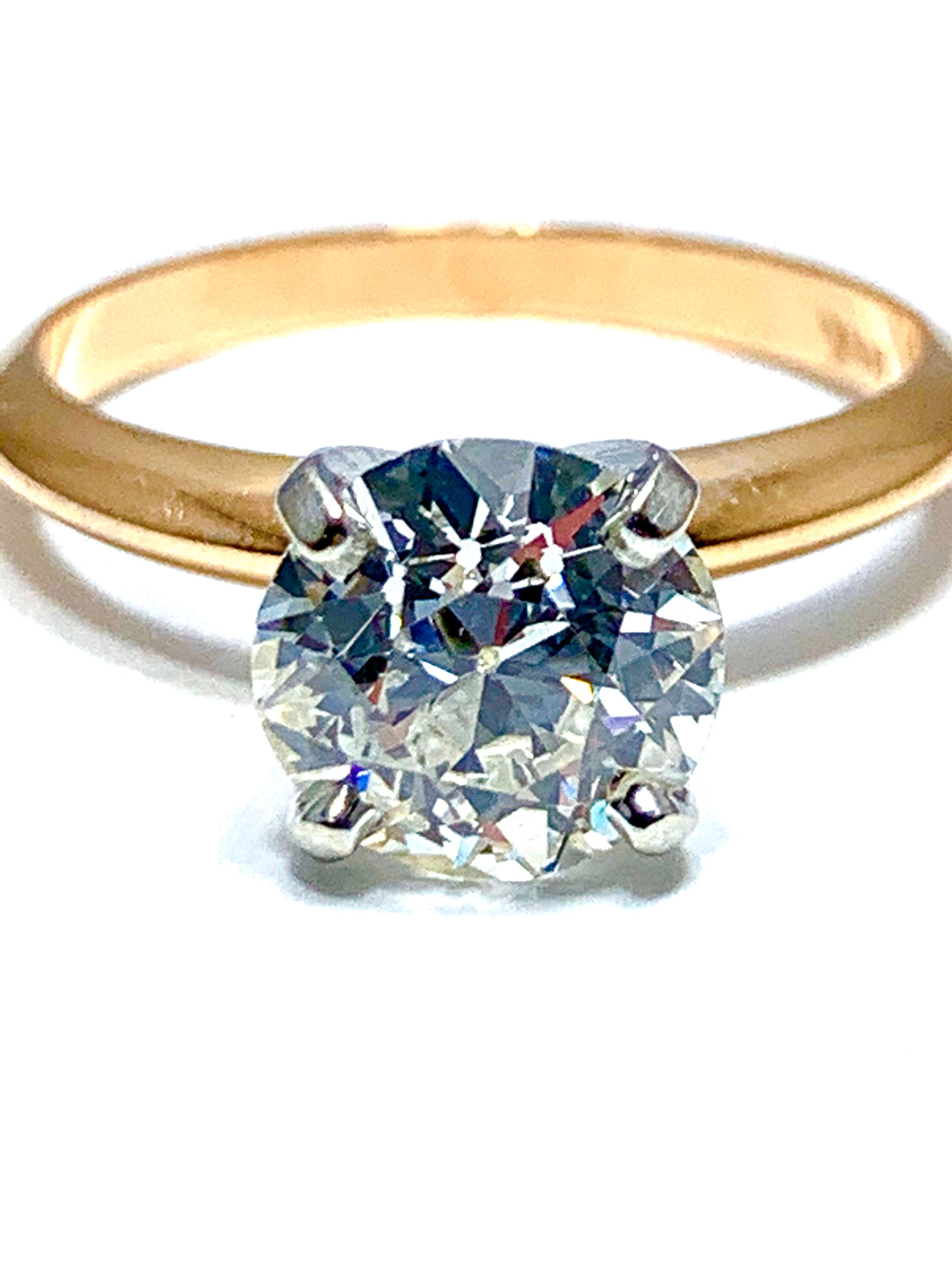 A gorgeous 1.52 carat old European cut diamond solitaire engagement ring.  The diamond is graded as I color, SI1 clarity, and  is set with a four prong platinum head, and a 14 karat rose gold knife edge shank.  The ring is currently a size 5.50, and