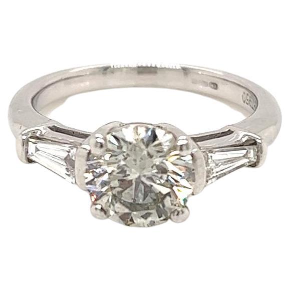 1.52 Carat Round Brilliant Diamond with Tapered Side Diamonds Platinum Ring For Sale
