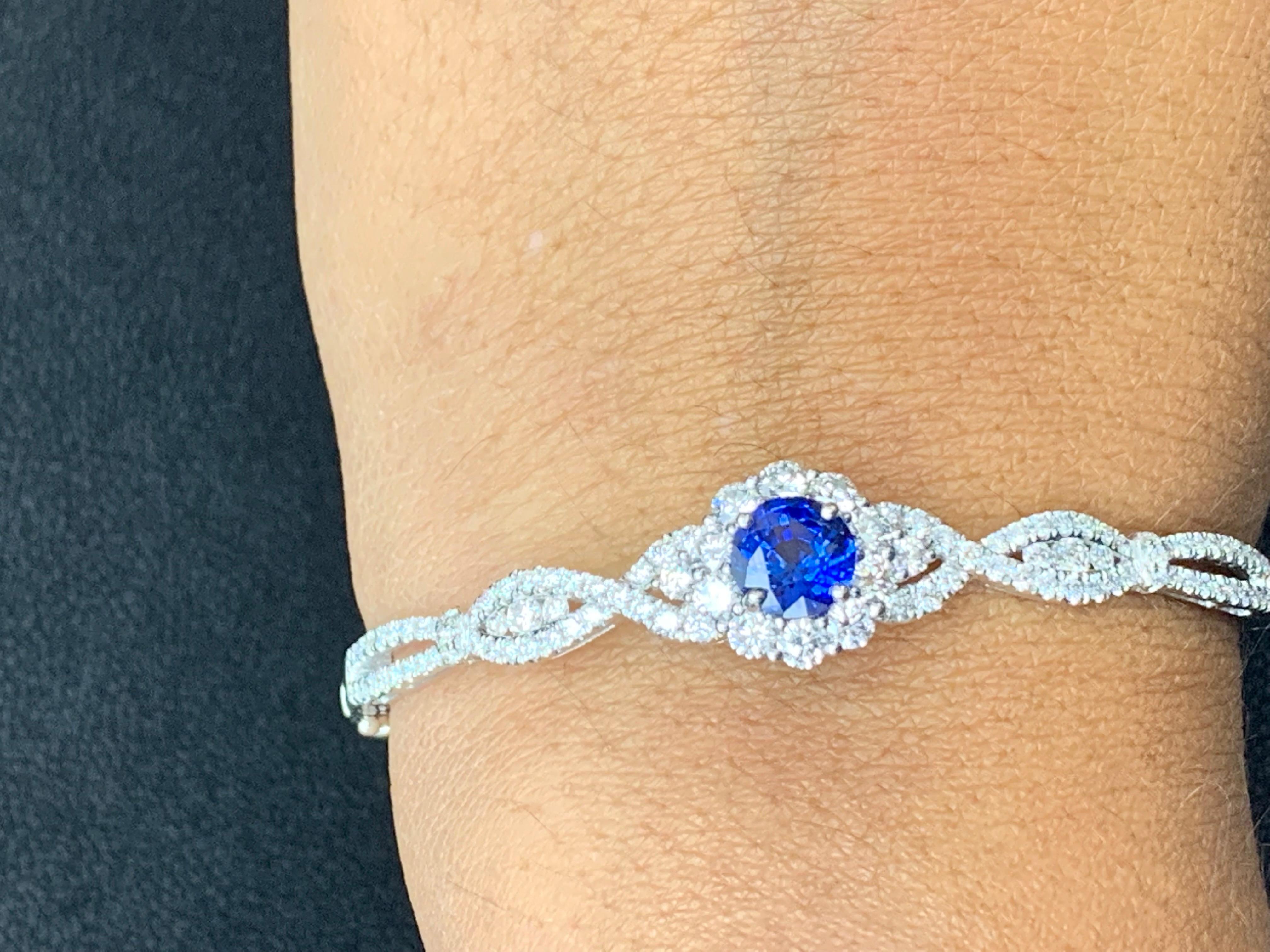 A unique and fashionable Sapphire bangle showcasing an openwork design set with 1.52 carat of Sapphire and 106 brilliant diamonds weighing 1.82 carat in total.  Made in 18k white gold.

Style available in different price ranges. Prices are based on