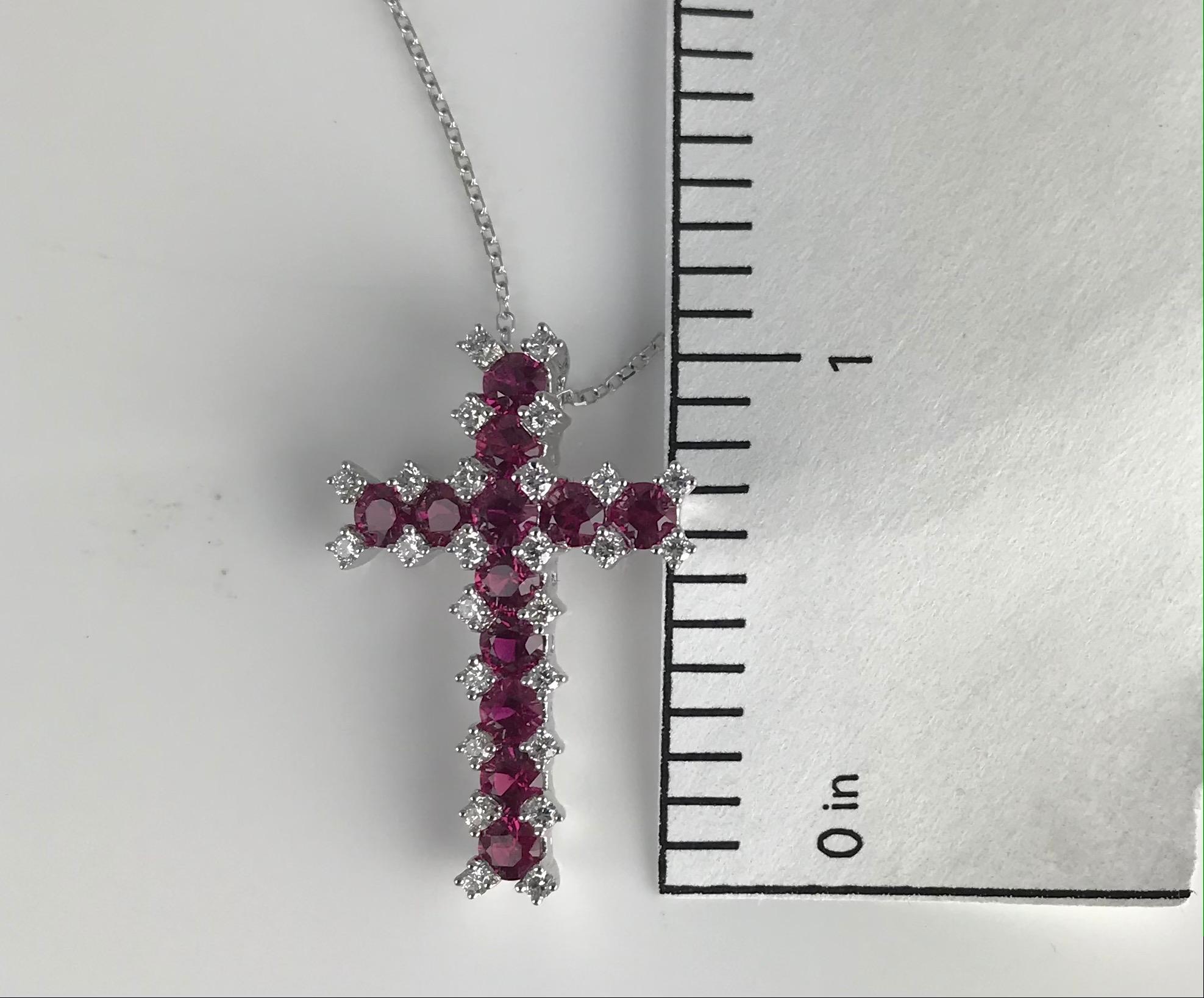 At the heart of this cross pendant, you'll find a dozen round rubies, totaling 1.52 carats. Rubies are known as the gemstone of love and passion, and their deep, velvety red hue is a testament to these sentiments. They add a touch of warmth and