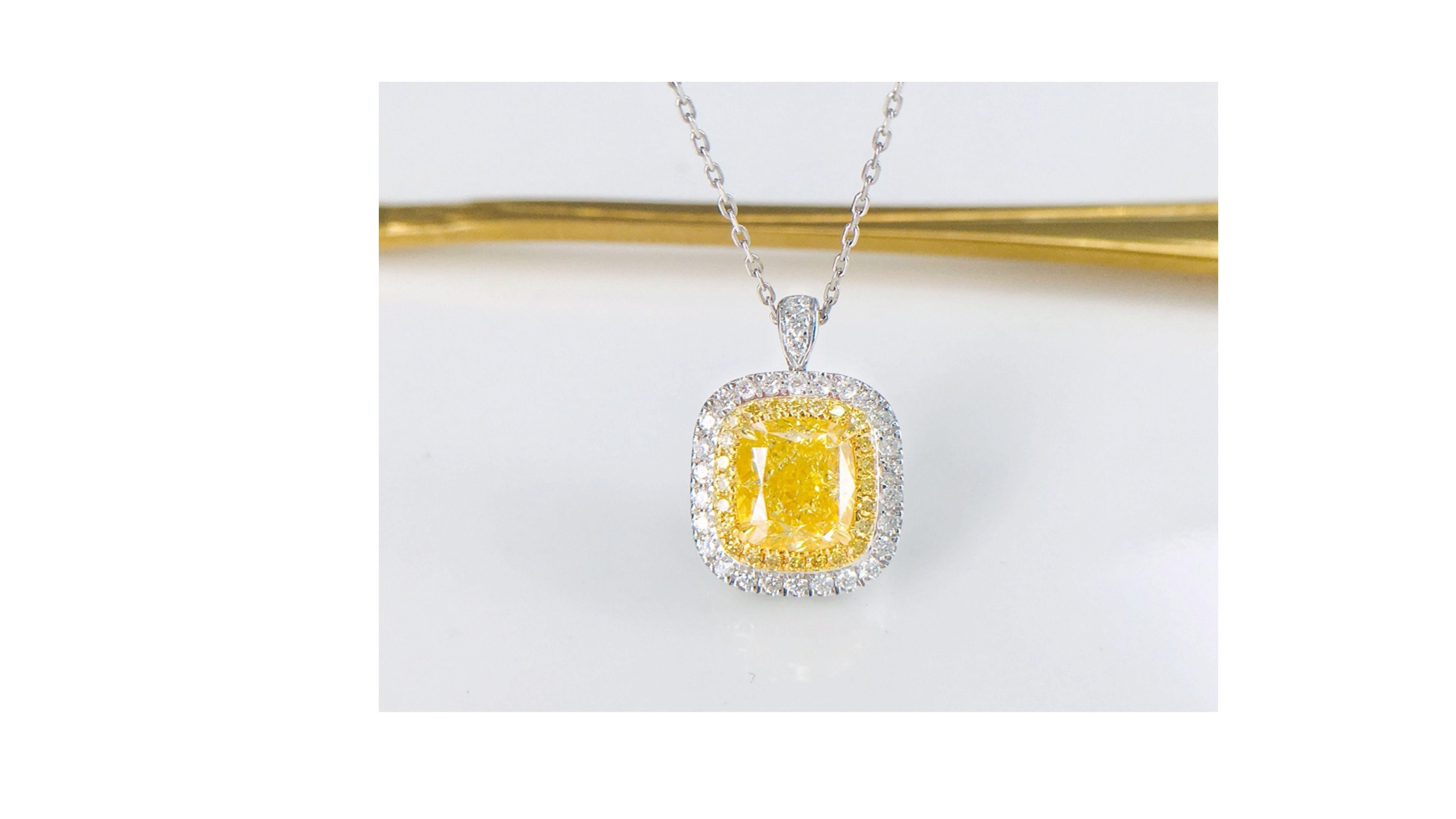 This  Fancy Yellow Diamond Necklace shows off a 2 Carat stone and stands out with 46 Diamonds inc baguette  ones at each side of the band with diamonds too.  Its also  set in 18 Karat White Gold .  You can also have this in a Ring  too as shown in