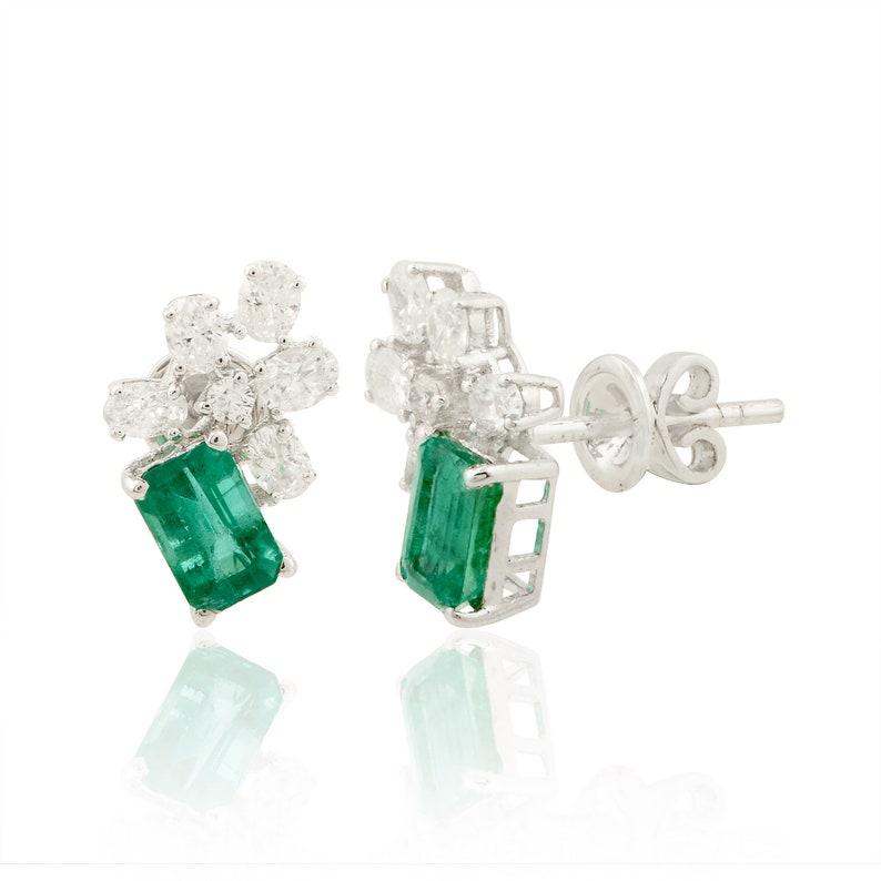 Cast in 14 karat gold, these stud earrings are hand set with 1.52 carats emerald and .72 carats of glimmering diamonds. 

FOLLOW MEGHNA JEWELS storefront to view the latest collection & exclusive pieces. Meghna Jewels is proudly rated as a Top