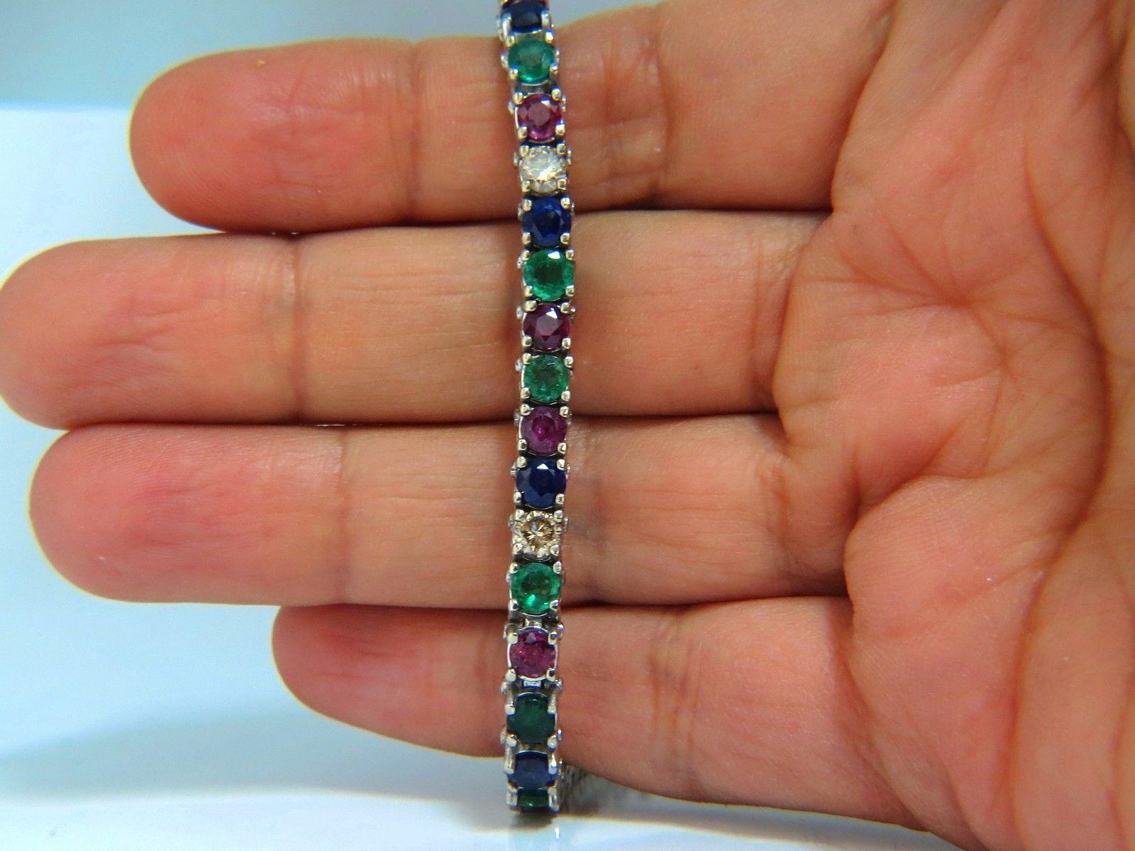 Gem Line.

14.00ct. Natural Sapphires, Ruby, & Emeralds bracelet.

Full round cuts, great sparkle.

Vibrant Greens, Reds, yellows, Blues & Pinks

Clean Clarity & Transparent.

1.20ct (5) Fancy light brown diamonds. 

Secure pressure clasp and safety