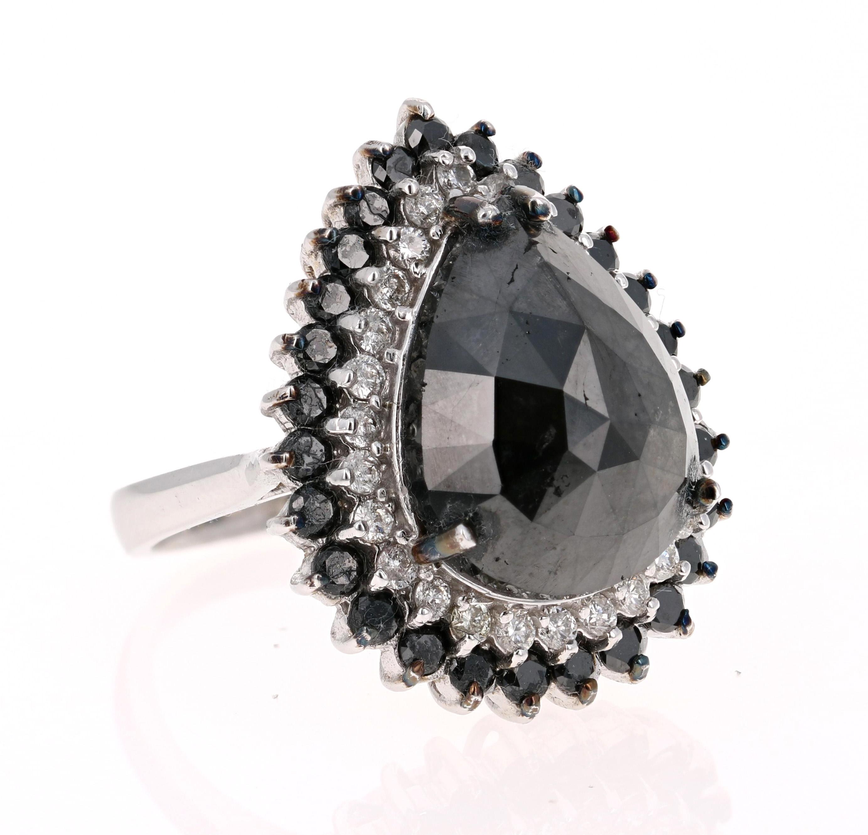 This Black and White Diamond Cocktail Ring is simply a Stunning Beauty! 

The Pear Cut Black Diamond is 13.25 Carats and is surrounded by a halo of 26 Round Cut Diamonds weighing 0.63 Carats. Additionally it has 27 Black Round Cut Diamonds that