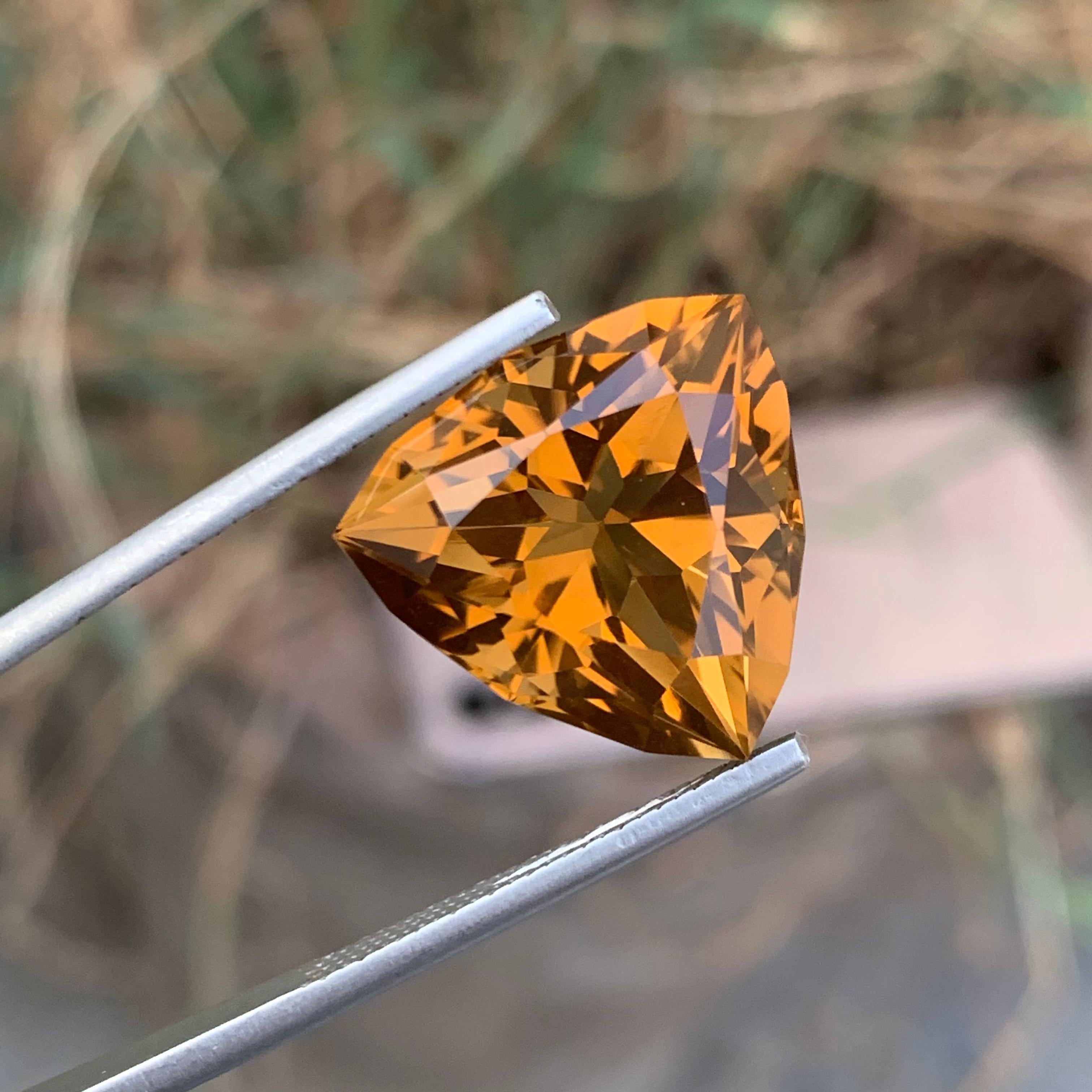 Faceted Citrine 
Weight: 15.25 Carats 
Dimension: 17x17.2x11.5 Mm
Shape: Trillion 
Treatment: Non
Color: yellow 
Certificate: On Customer Demand 
Citrine is a captivating gemstone known for its warm, yellowish hue. This quartz variety derives its