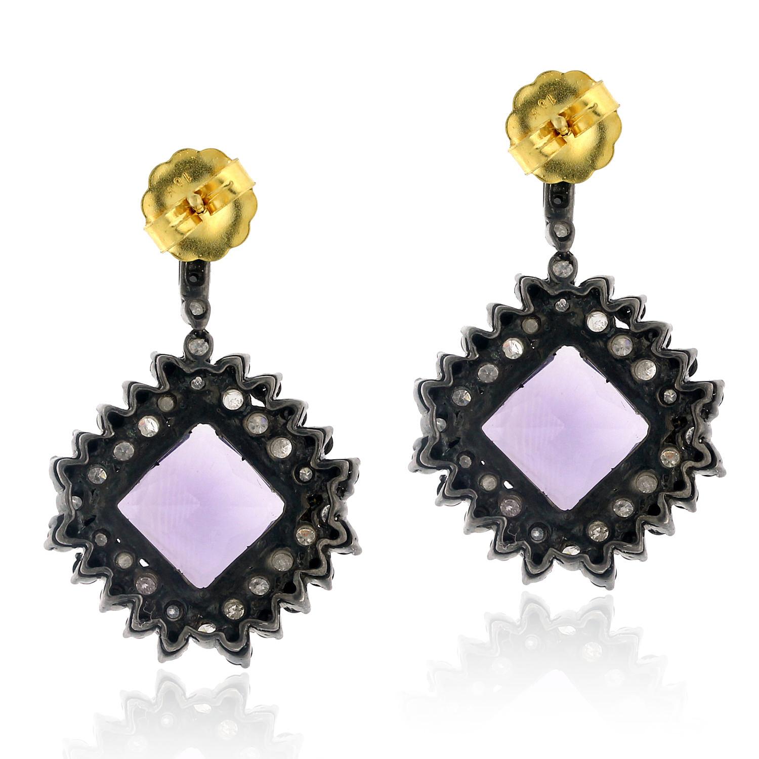 15.25cts Amethyst drop earring with Black and White Diamond in silver and gold is cool and very attractive.

Closure: Push Post

18kt gold: 1.98gms
Diamond: 3.74cts
Silver: 11.52gms
Amethyst: 15.25cts
