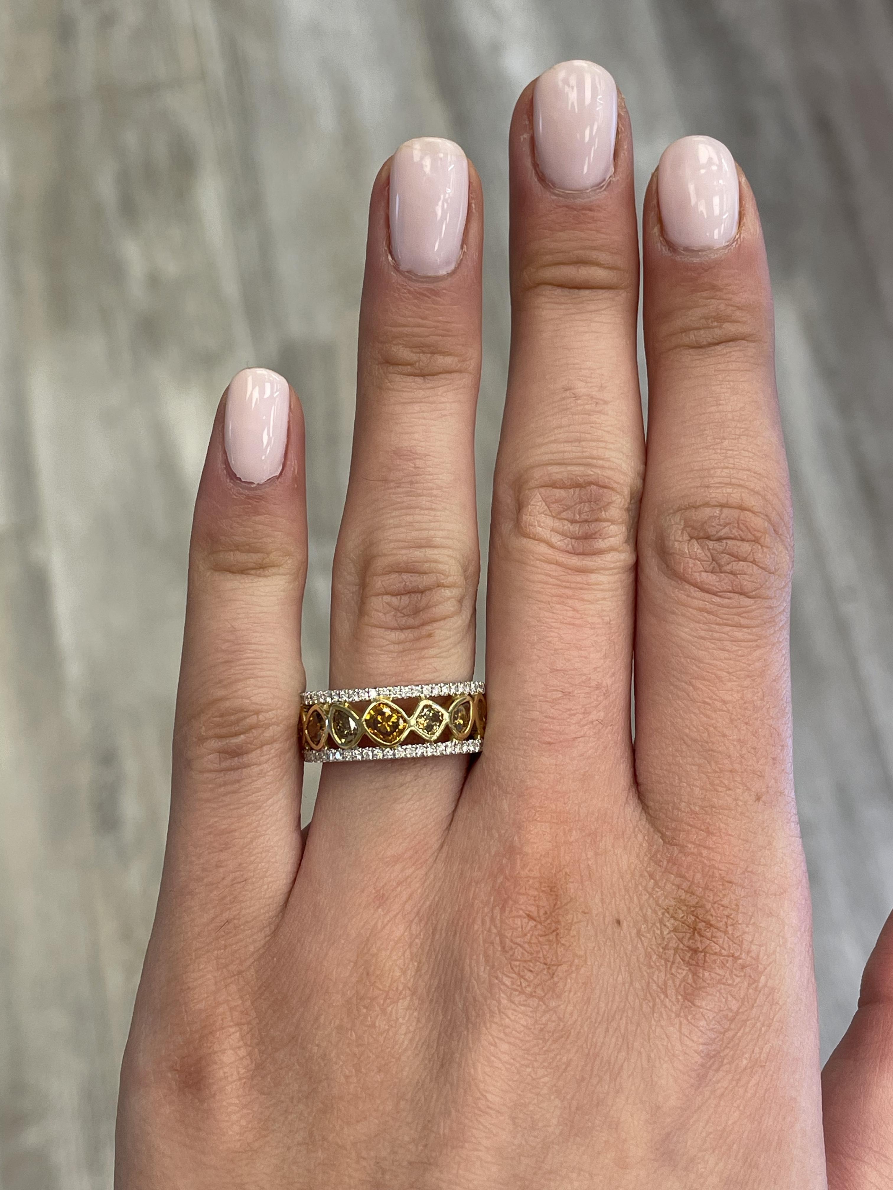Lovely yellow to brownish yellow diamond cocktail ring.
1.52 carats total diamond weight.
11 mixed shape brown diamonds, 1.30 carats. Approximately Fancy Orange Brown  - Fancy Brown color and SI clarity. Complimented by 50 round diamonds, 0.22
