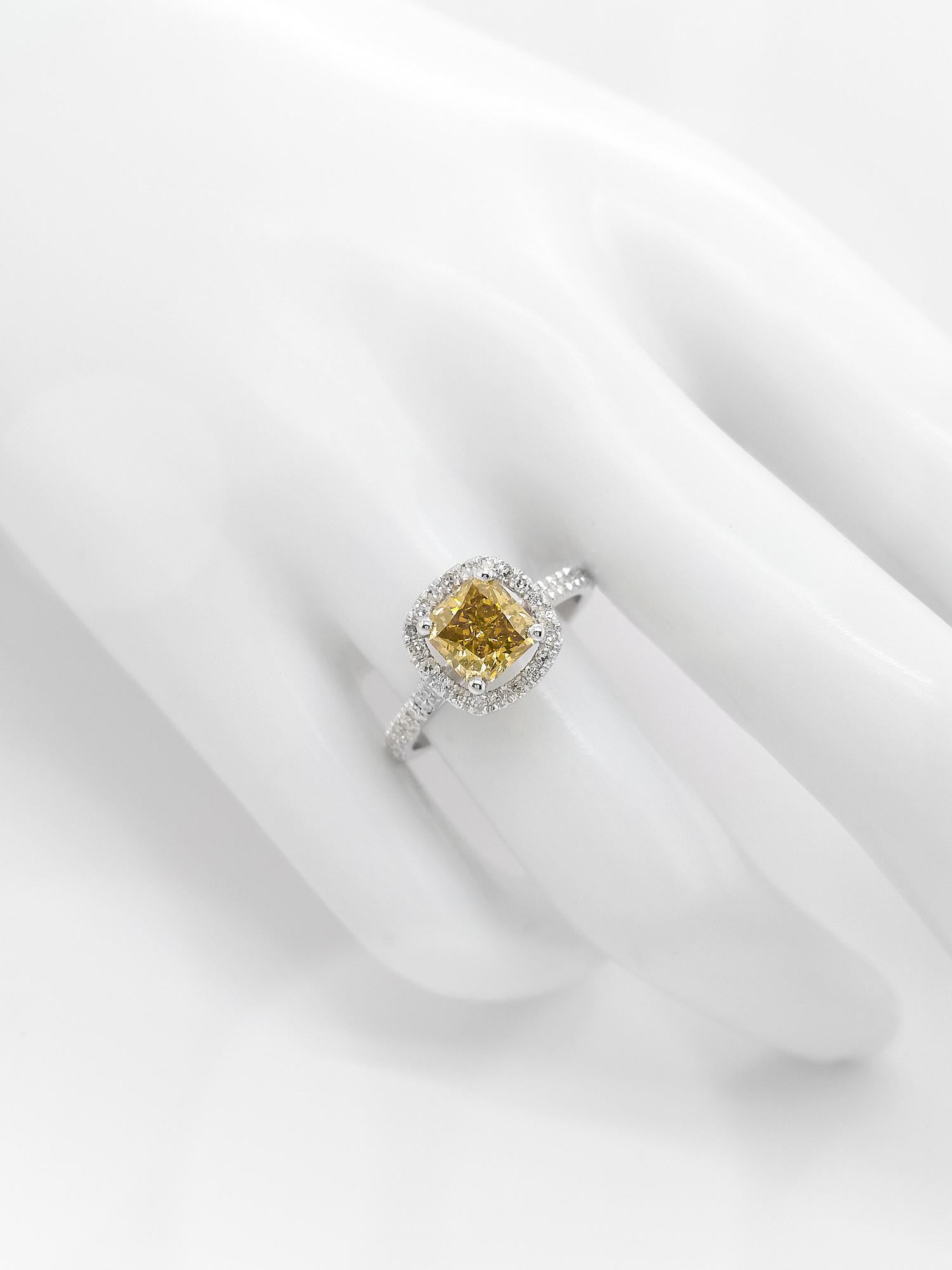 FOR U.S. BUYERS NO VAT 

In this elegant and classy 14kt white gold ring, 1.52 carat fancy greenish yellow diamond ring is surrounded by 38 natural round brilliant diamonds totaling 0.35 carats round brilliant diamonds and creating a very gentle and