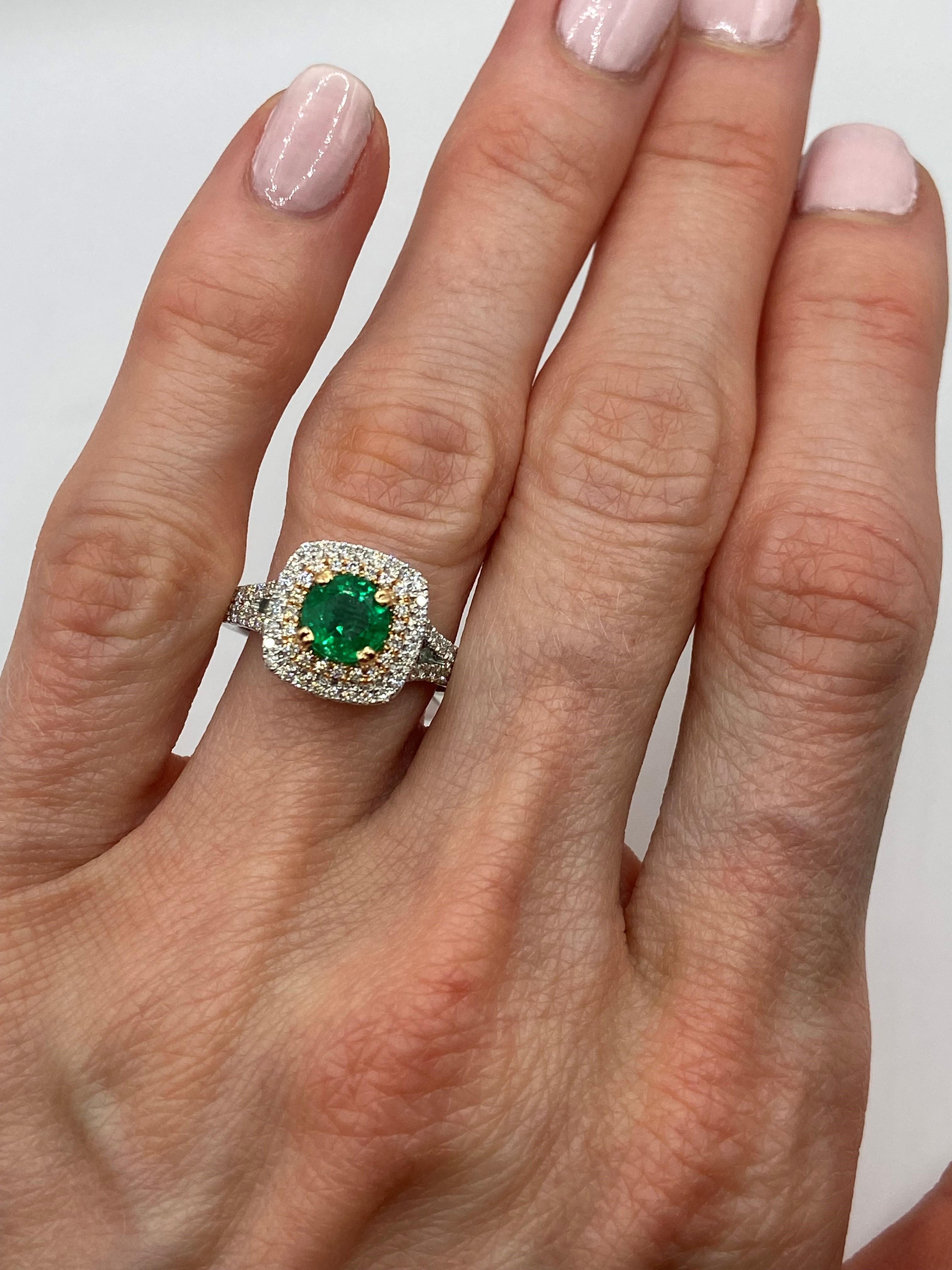 18KT White & Rose Gold
Size: 6.5

Number of Green Emeralds: 1
Carat Weight: 0.90ctw
Stone Size: 6mm
Color: Bright Green

Round Diamonds: 0.62ctw

This beautiful ring showcases a bright green emerald center stone. The stone weights 0.90 carats and is