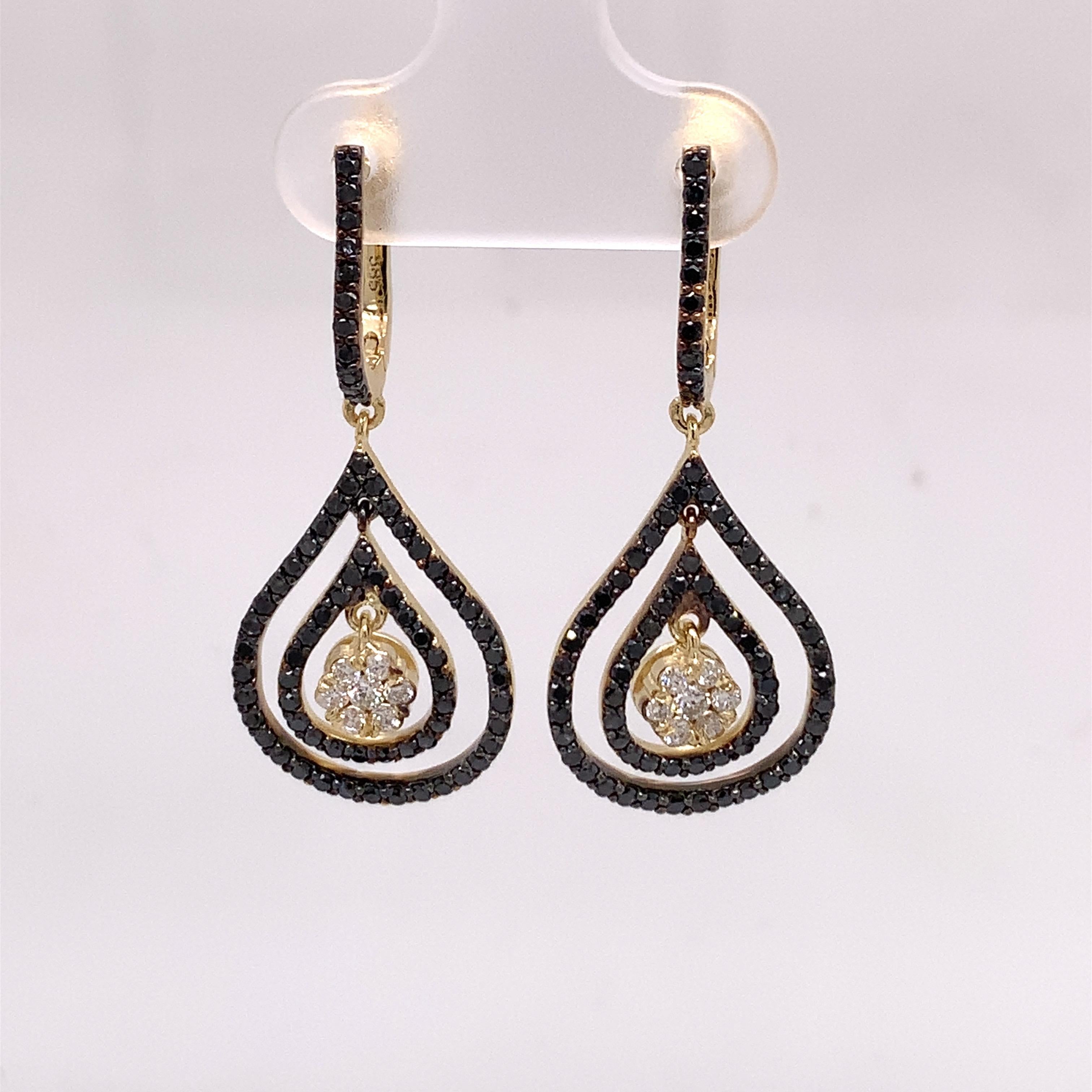 The 1.53 Carat timeless dangle earrings showcase the beauty of timeless classic earrings and a modern mix of black and white diamonds. The diamonds are set on 14K yellow gold. 

Jewel details: 
White Diamonds-
0.23 Carat Total Weight
E-F / VS
Black
