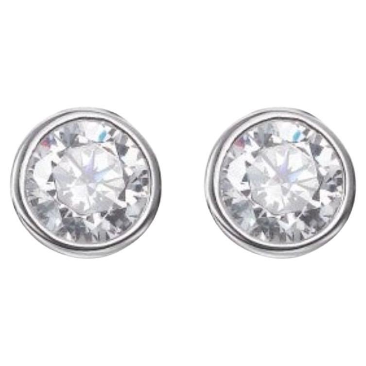 Classic yet timeless, these simple circular stud earrings are set with a single round brilliant cut cubic zirconia measuring 1.53carat.

Each stud showcases a sparkling cubic zirconia stone set in a rub-over setting, adding a touch of glamour to any